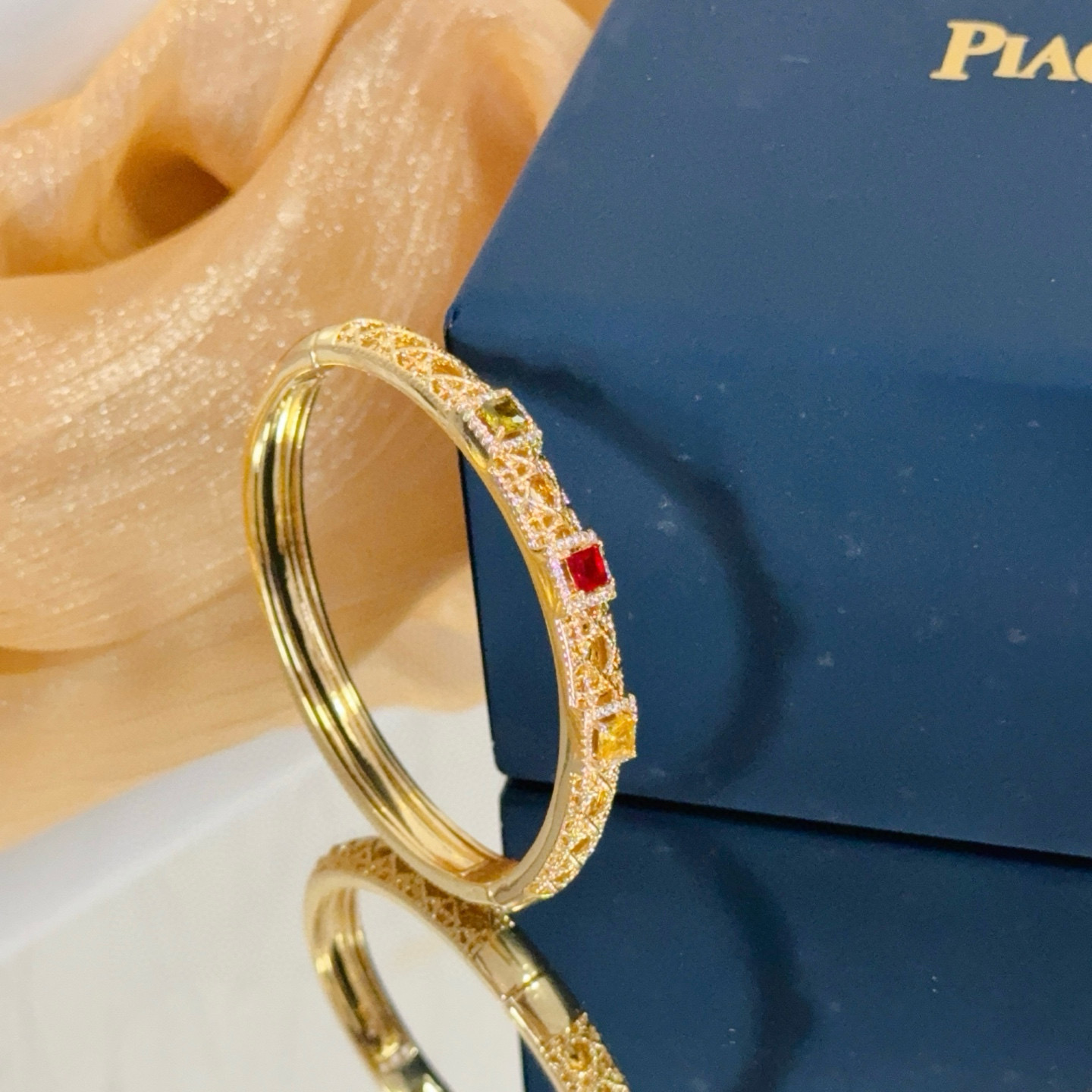 Piaget Sunlight Journey bracelet 18k yellow gold with red yellow green gemstones and diamond accents 17cm inner circumference
