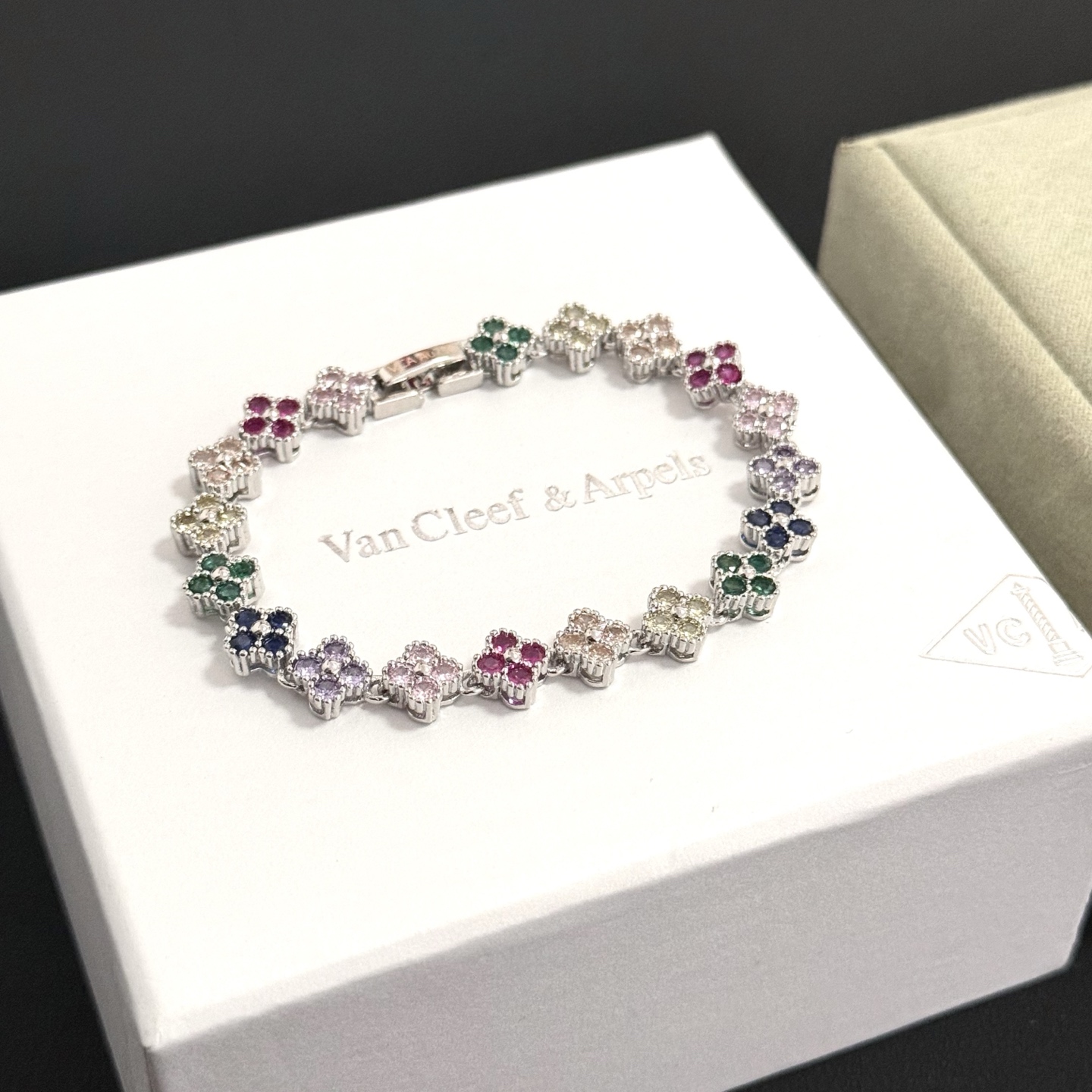 Van Cleef Arpels Alhambra bracelet Silver-toned metal with multicolor gemstones fuchsia pink light pink champagne pale yellow green navy blue lavender purple 18cm