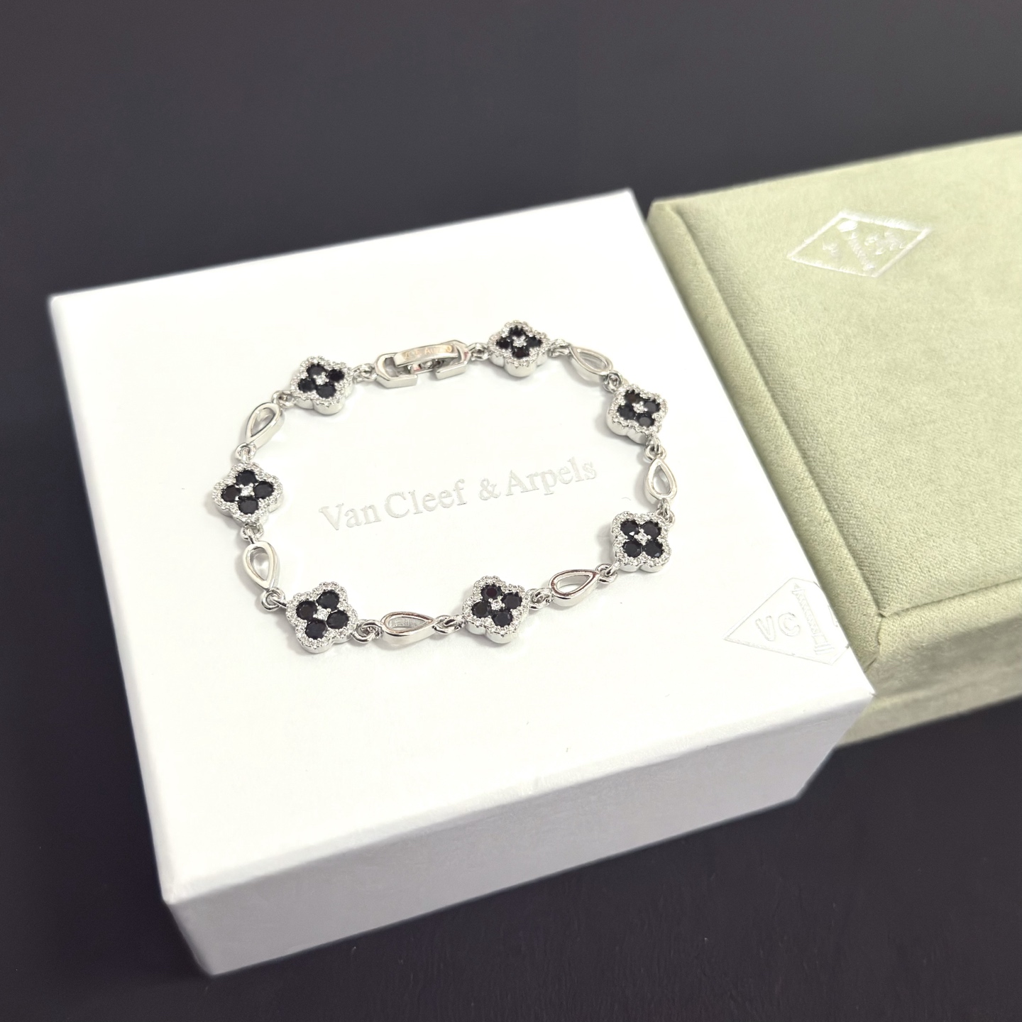 Van Cleef Arpels Alhambra bracelet silver-toned metal with black onyx and clear diamond accents 18cm