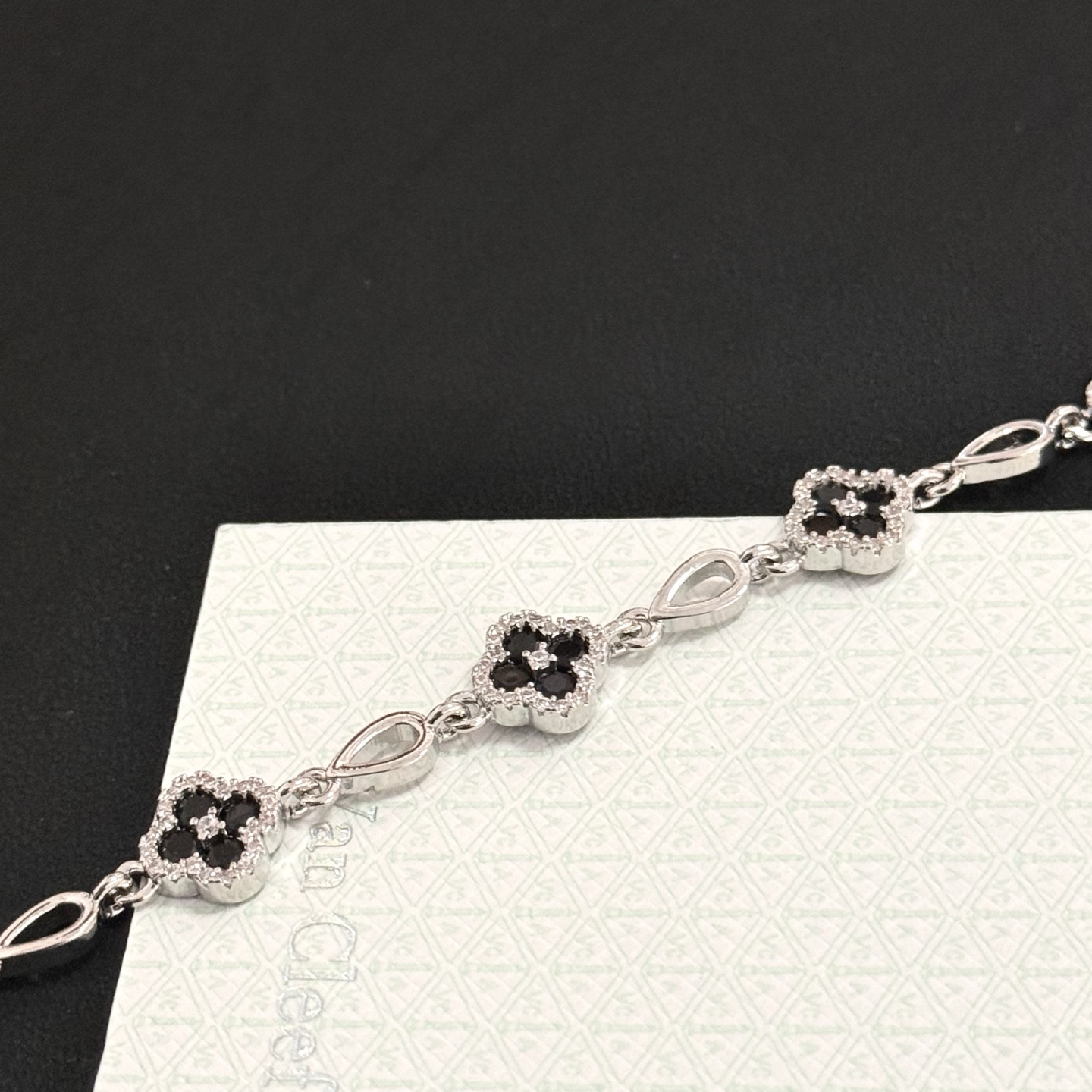 Van Cleef Arpels Alhambra bracelet silver-toned metal with black onyx and clear diamond accents 18cm