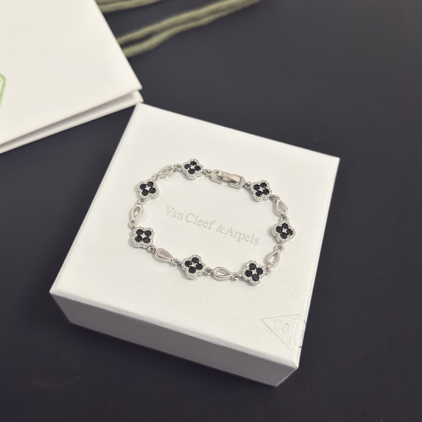 Van Cleef Arpels Alhambra bracelet silver-toned metal with black onyx and clear diamond accents 18cm