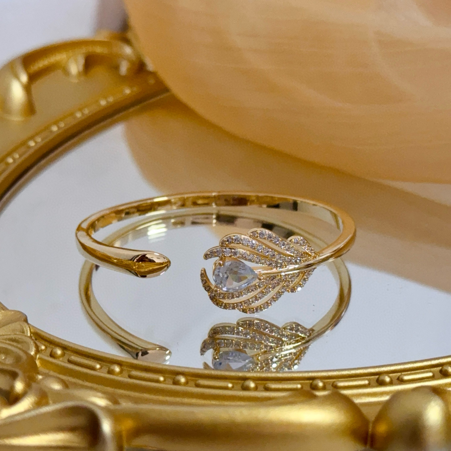 Piaget Feather Motif Open Cuff bracelet Yellow gold metal with clear faceted gemstones and pave-set clear accent stones 17cm inner circumference