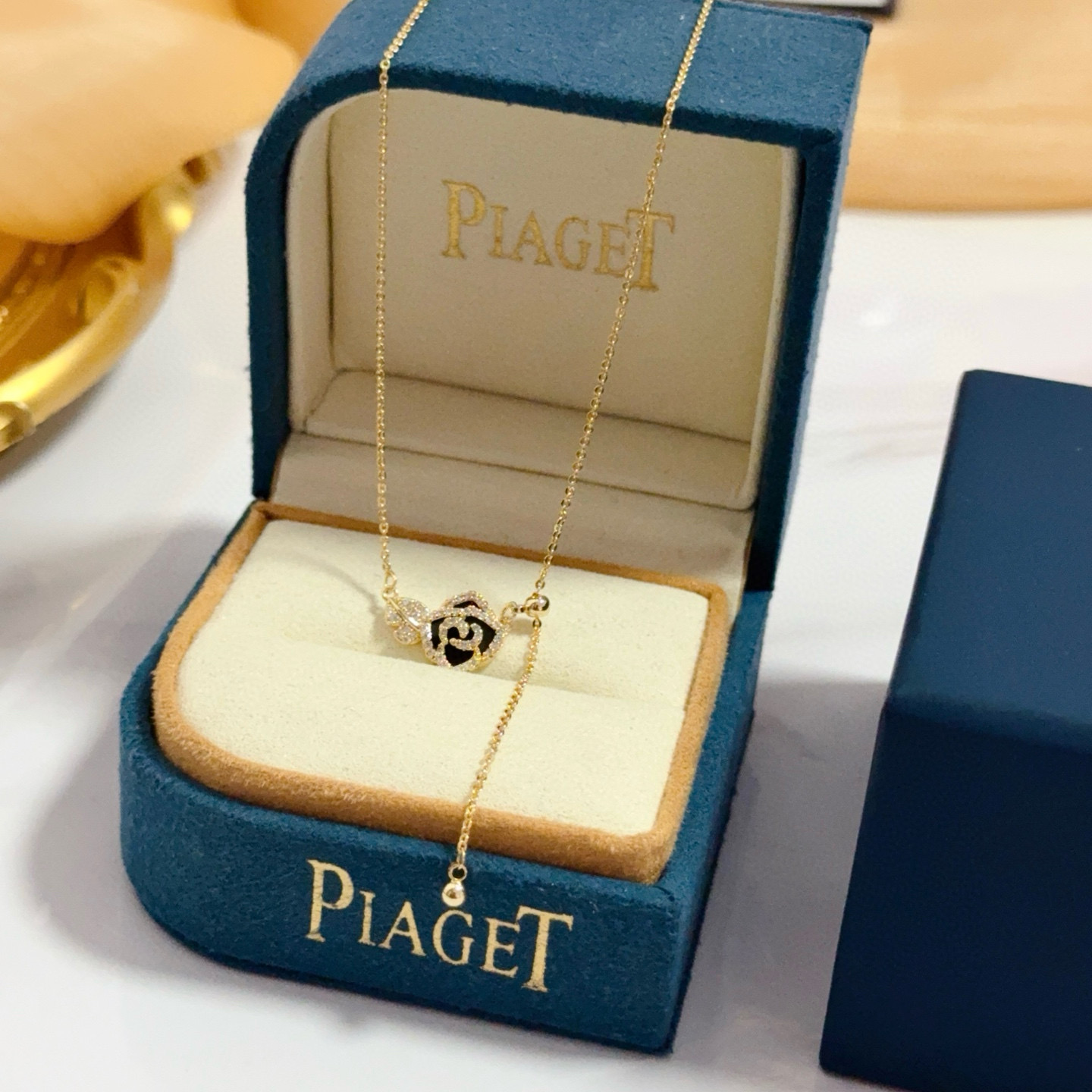 Piaget Rose necklace yellow gold with black enamel and clear diamond accents 45cm