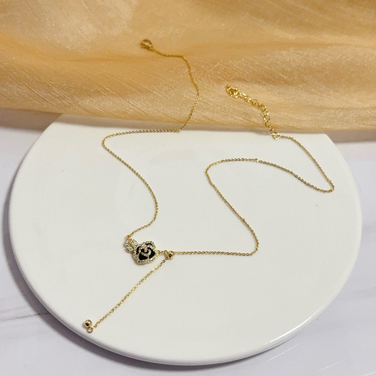Piaget Rose necklace yellow gold with black enamel and clear diamond accents 45cm