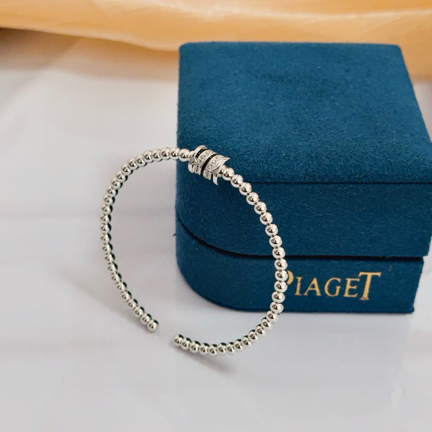 Piaget Possession bracelet silver-toned white gold with clear diamond accents and black enamel detailing 17cm