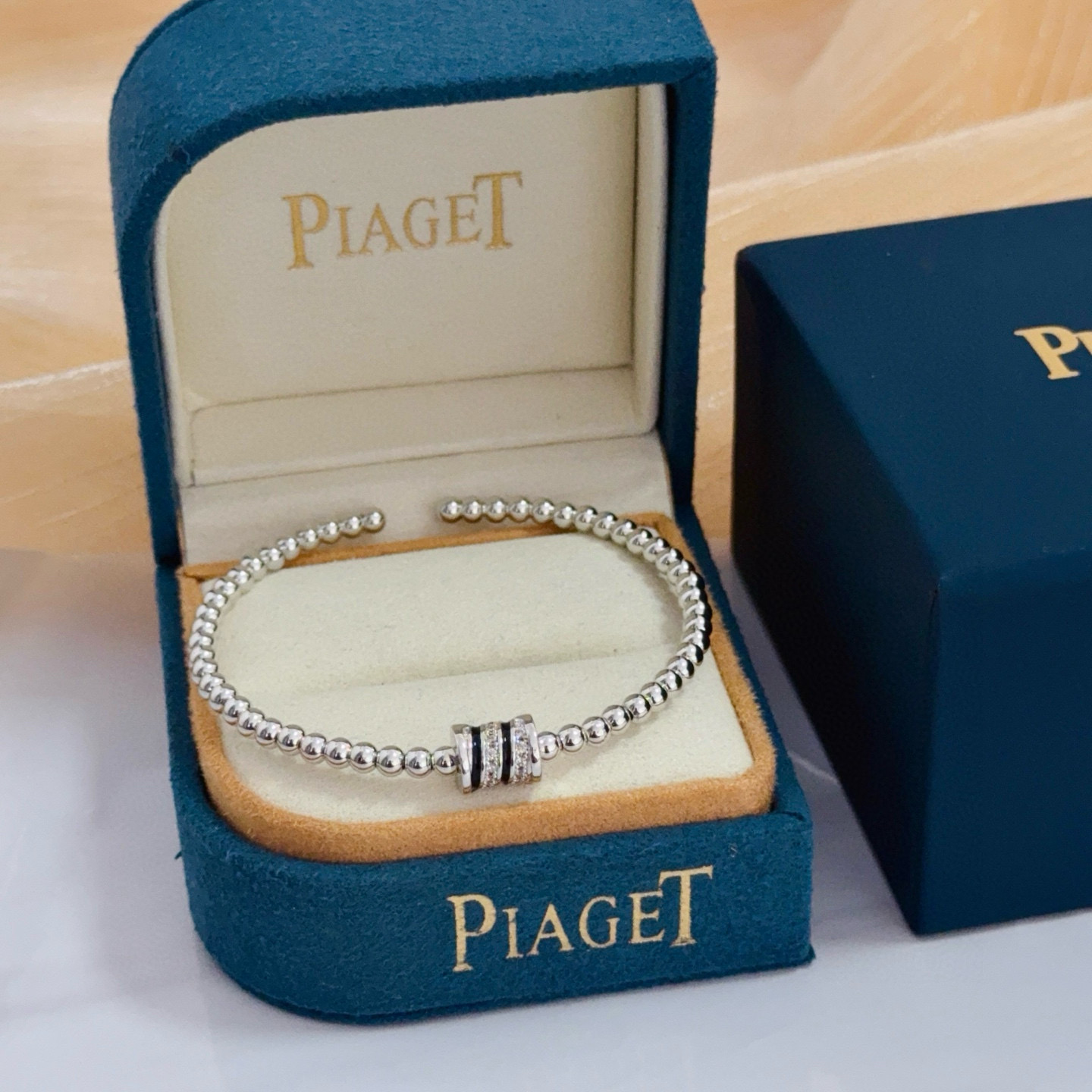 Piaget Possession bracelet silver-toned white gold with clear diamond accents and black enamel detailing 17cm
