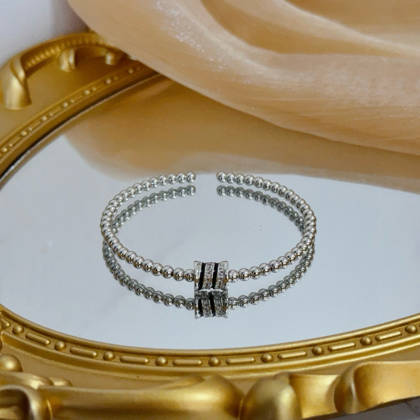 Piaget Possession bracelet silver-toned white gold with clear diamond accents and black enamel detailing 17cm