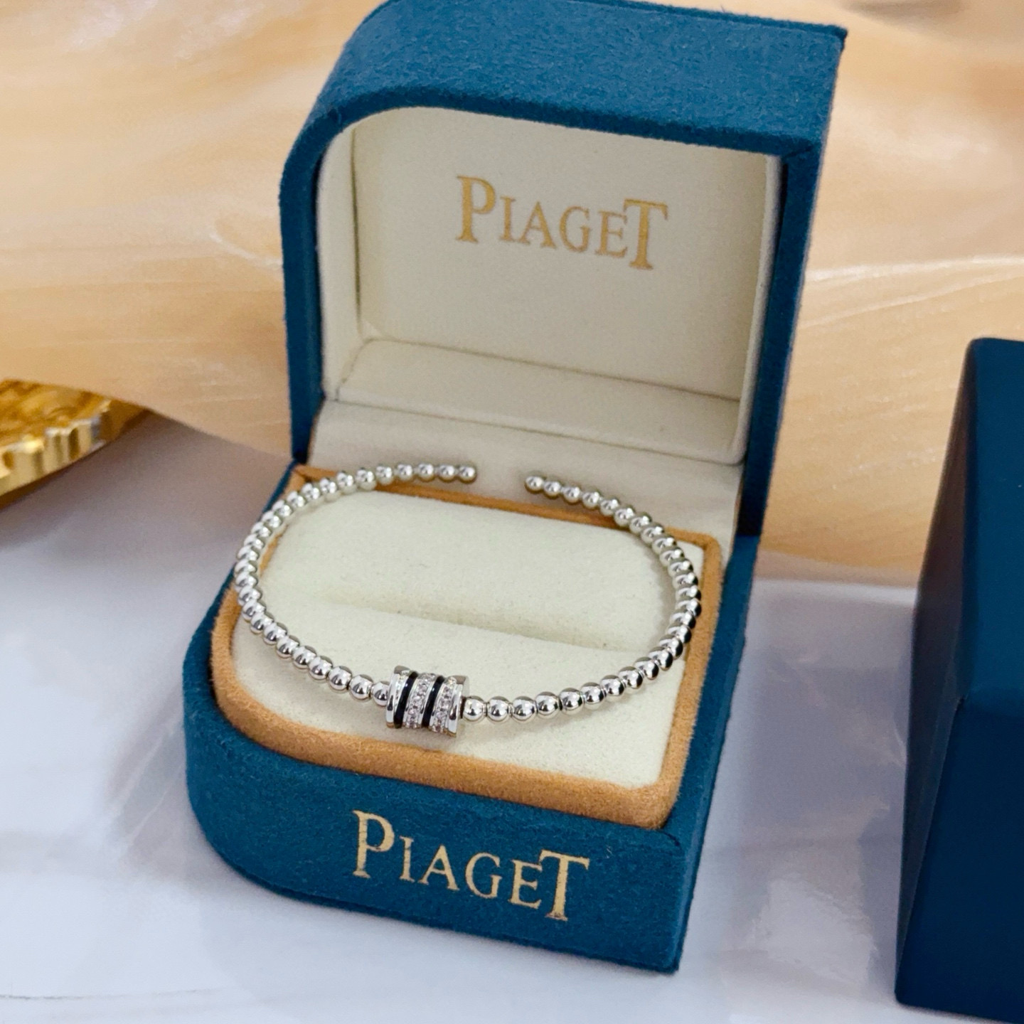 Piaget Possession bracelet silver-toned white gold with clear diamond accents and black enamel detailing 17cm