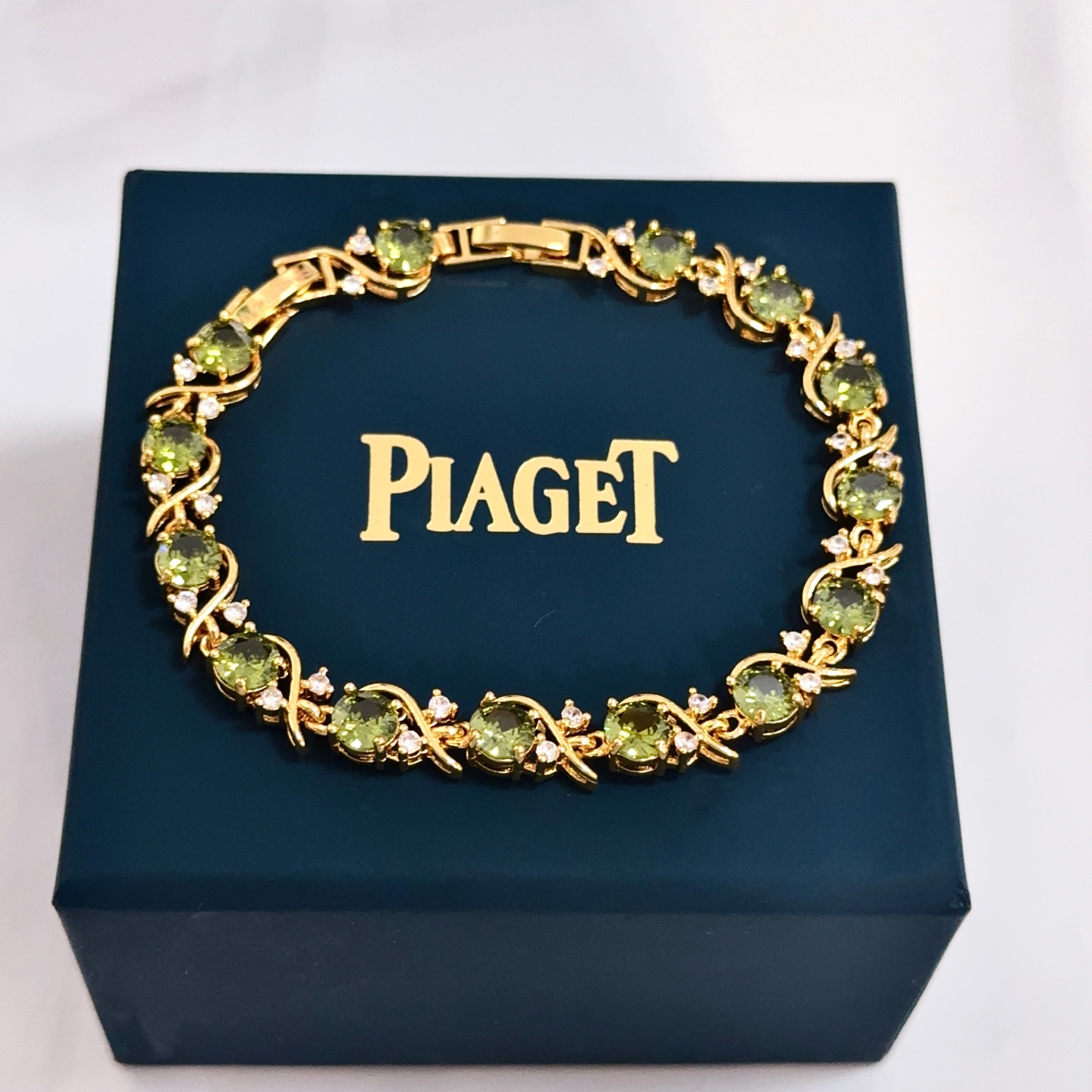 Piaget Rose Vine Gemstone Line Bracelet bracelet Yellow gold metal with olive green peridot and clear diamond accent stones 18cm