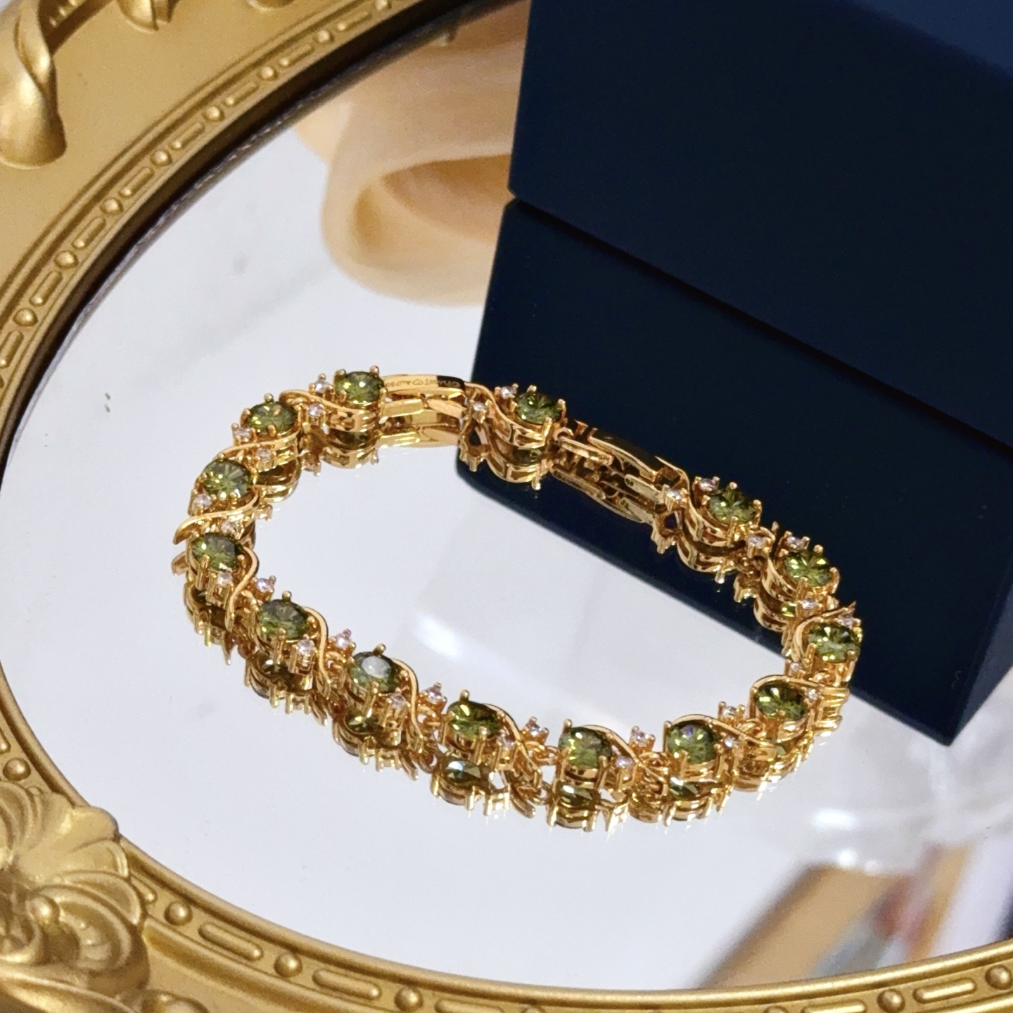 Piaget Rose Vine Gemstone Line Bracelet bracelet Yellow gold metal with olive green peridot and clear diamond accent stones 18cm
