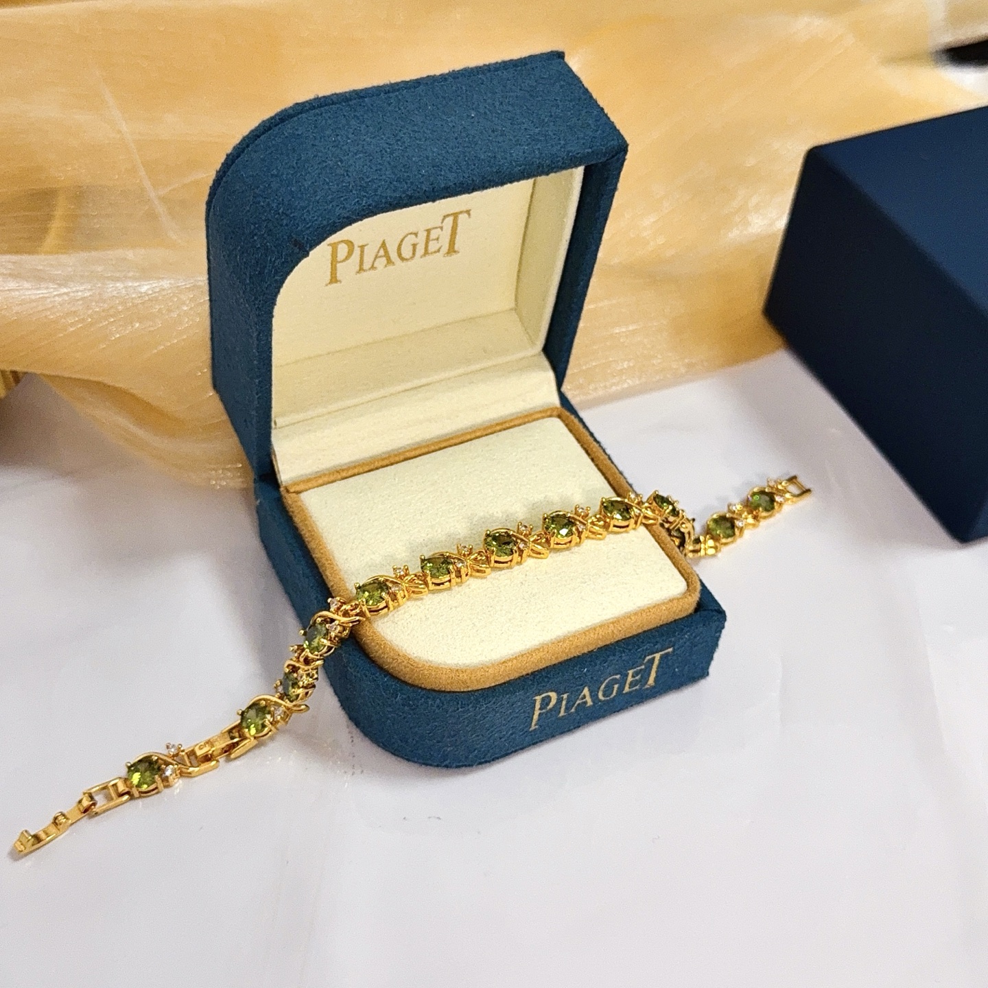 Piaget Rose Vine Gemstone Line Bracelet bracelet Yellow gold metal with olive green peridot and clear diamond accent stones 18cm