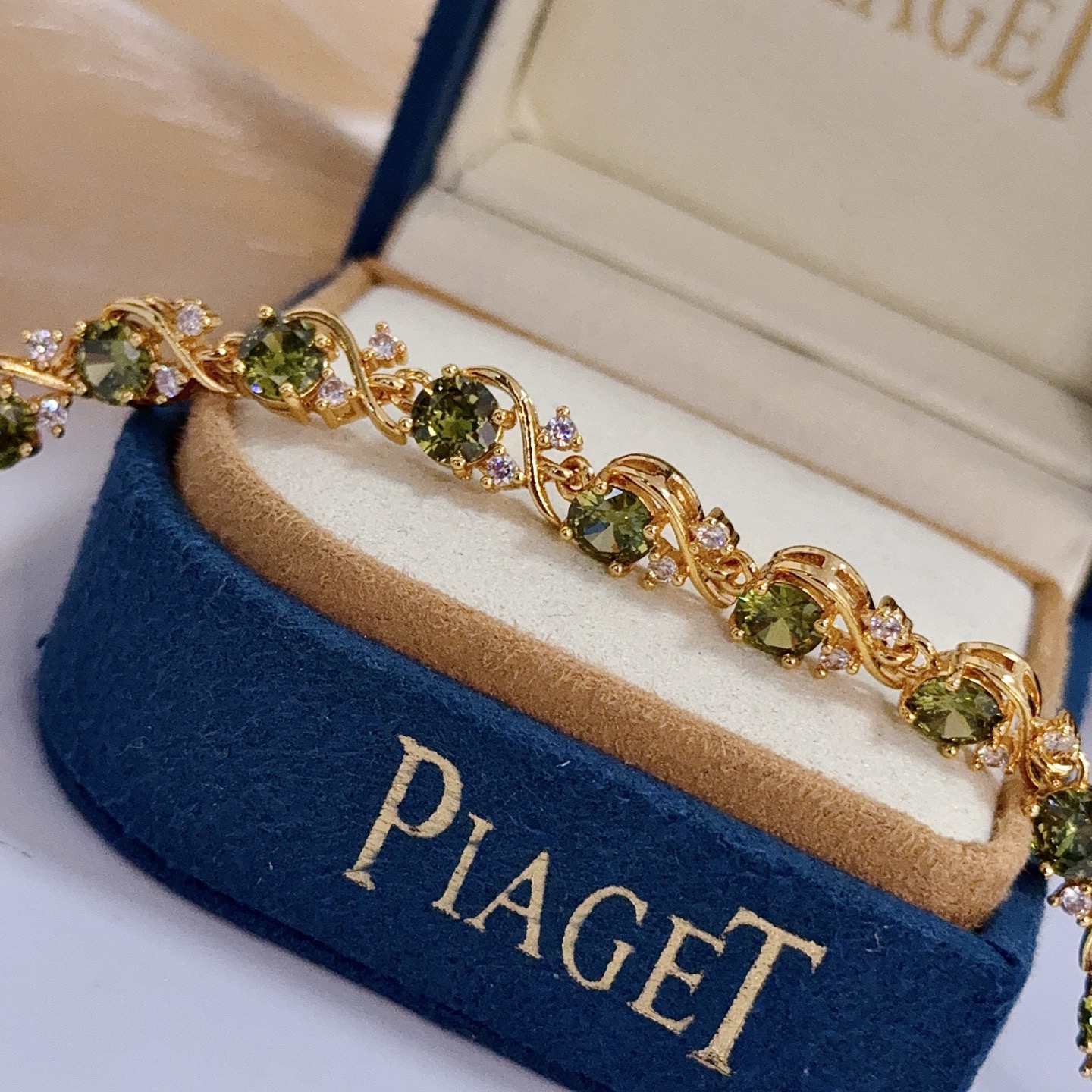 Piaget Rose Vine Gemstone Line Bracelet bracelet Yellow gold metal with olive green peridot and clear diamond accent stones 18cm