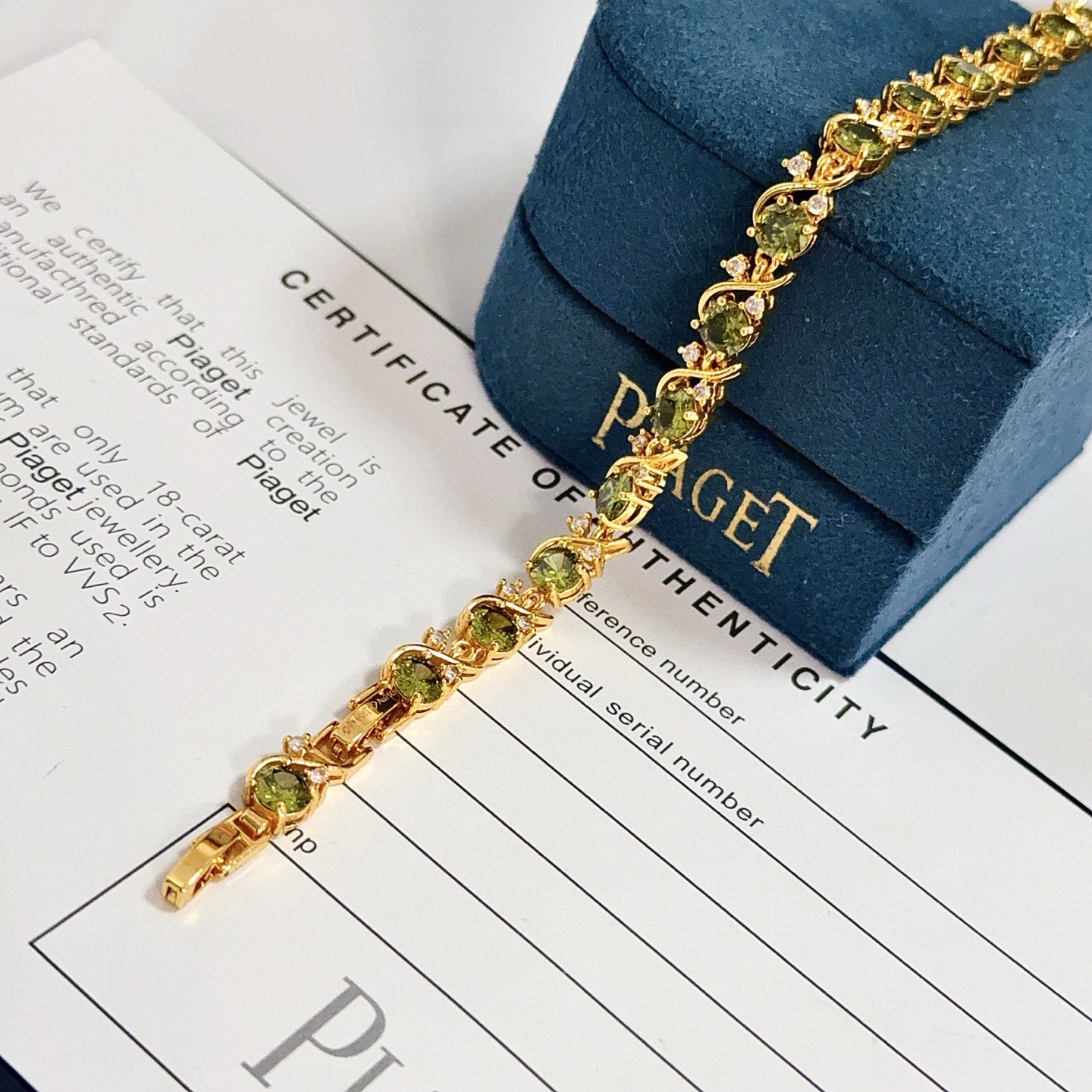 Piaget Rose Vine Gemstone Line Bracelet bracelet Yellow gold metal with olive green peridot and clear diamond accent stones 18cm