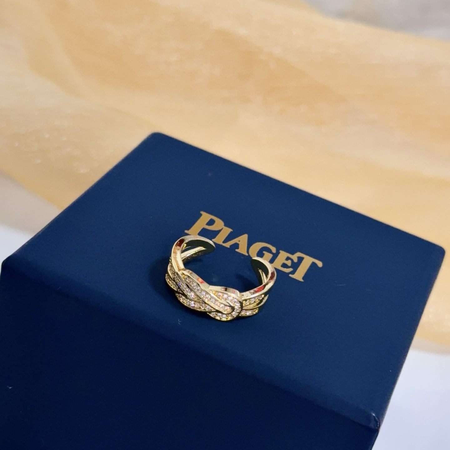 Piaget Possession Knot ring yellow gold with clear diamond accents adjustable open band