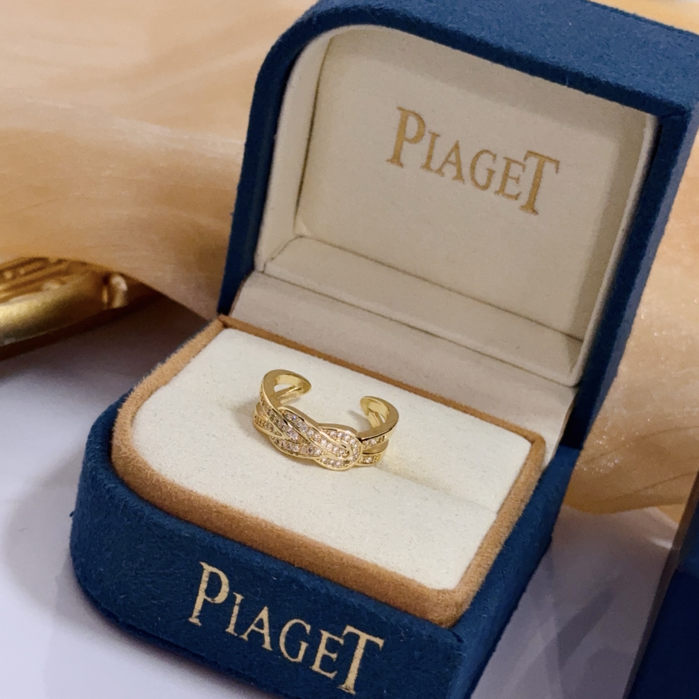 Piaget Possession Knot ring yellow gold with clear diamond accents adjustable open band
