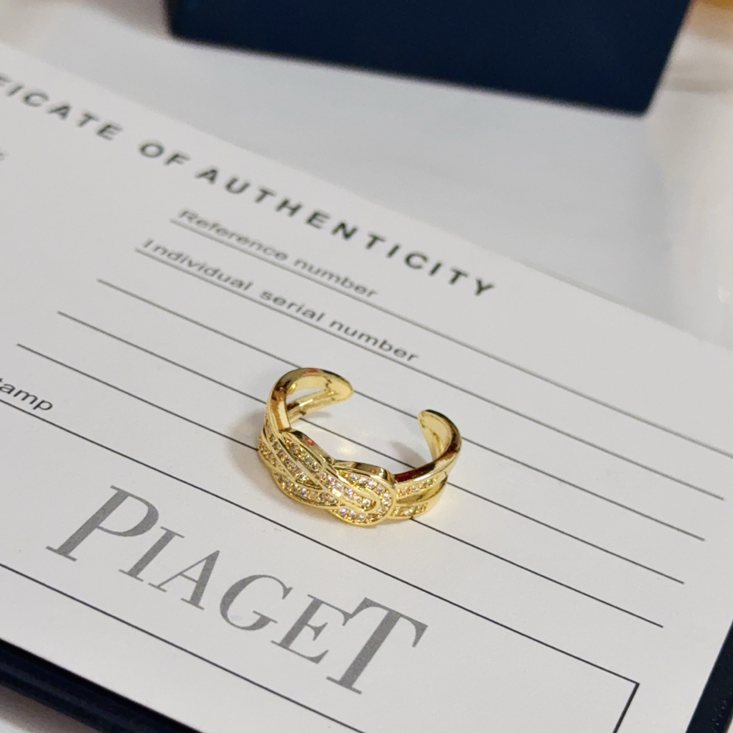 Piaget Possession Knot ring yellow gold with clear diamond accents adjustable open band