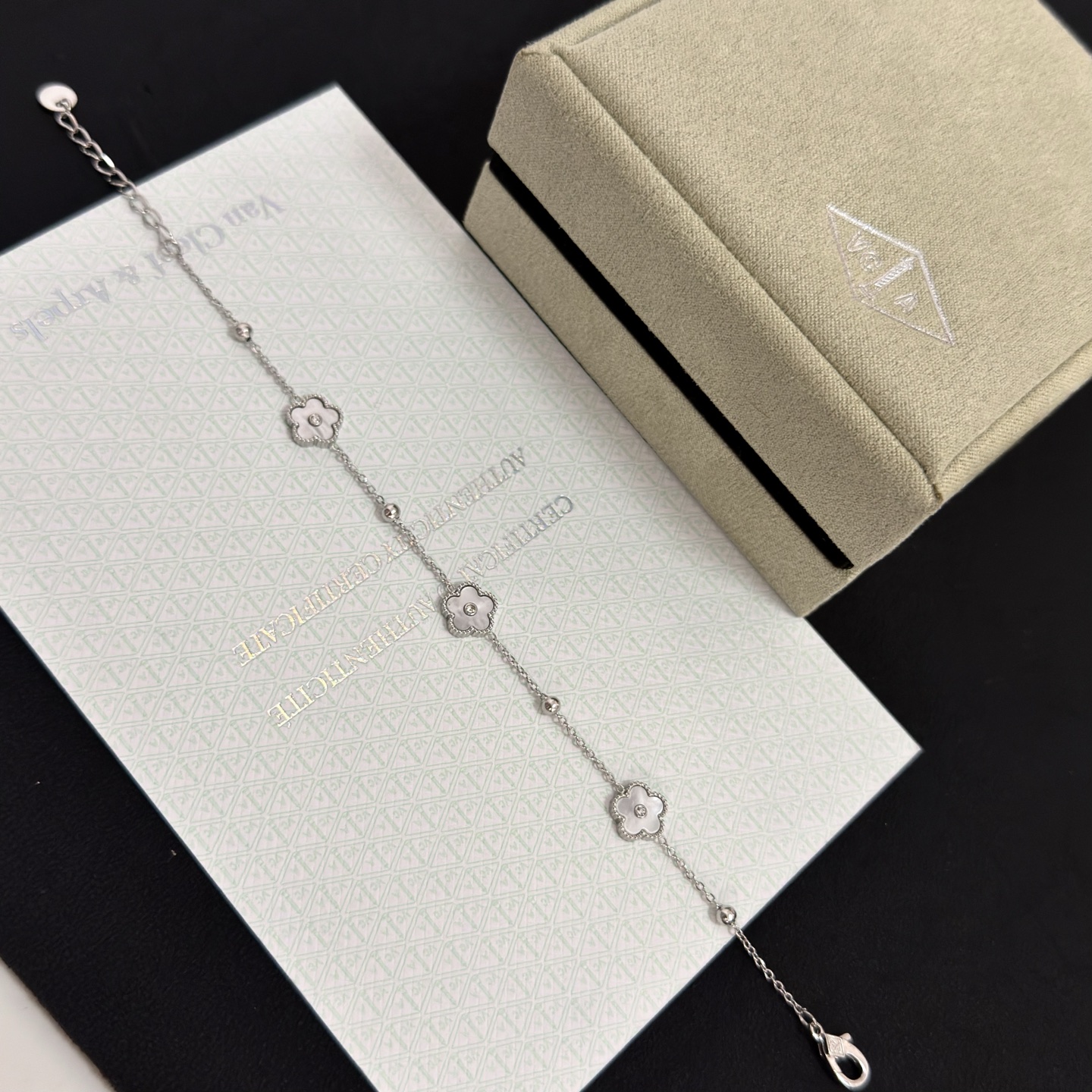 Van Cleef Arpels Alhambra bracelet silver-toned metal white mother-of-pearl clear diamond accents 17cm