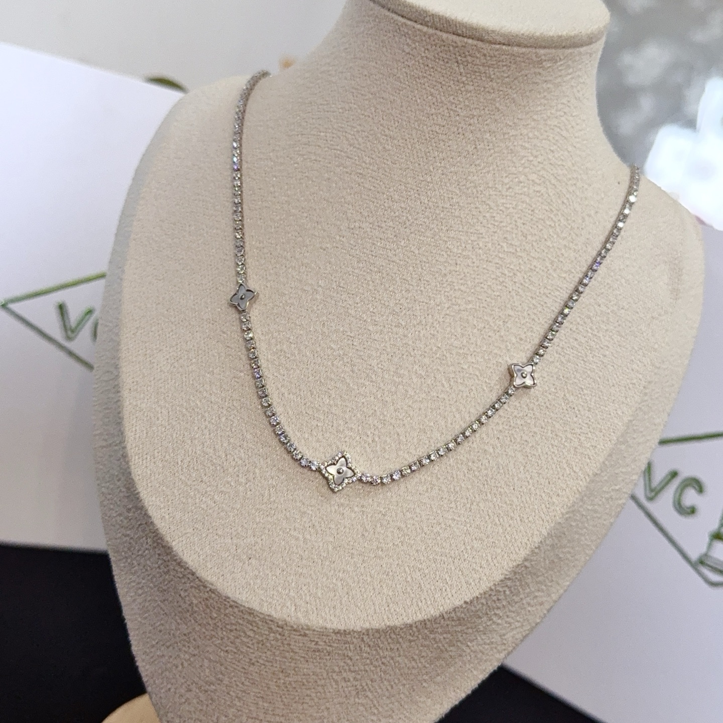 Van Cleef Arpels Alhambra necklace silver-toned white gold metal with clear diamond accents and mother-of-pearl clover motifs 42cm with 5cm extender chain