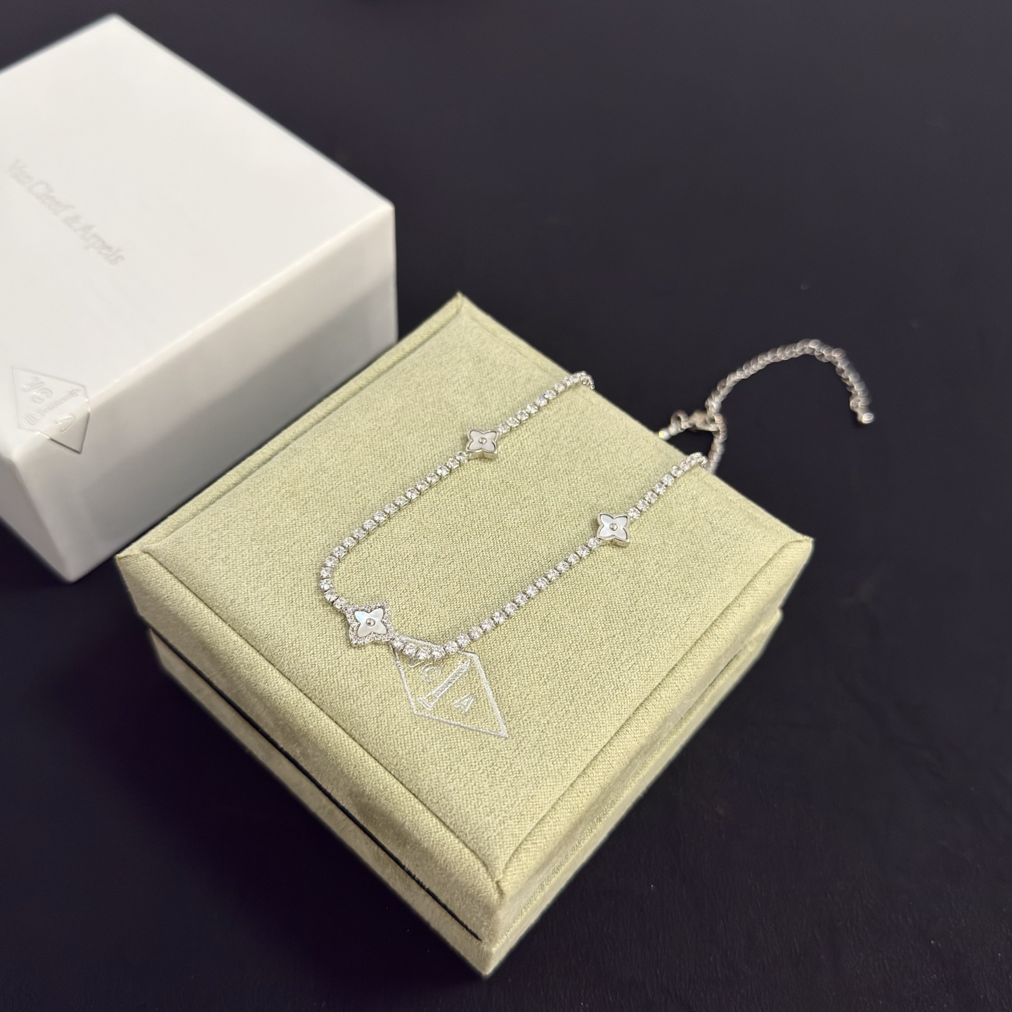 Van Cleef Arpels Alhambra necklace silver-toned white gold metal with clear diamond accents and mother-of-pearl clover motifs 42cm with 5cm extender chain