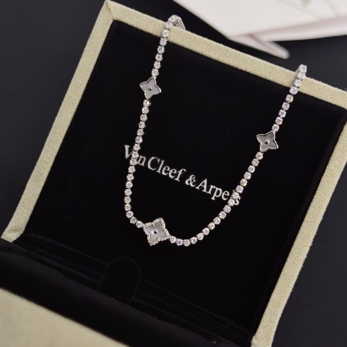 Van Cleef Arpels Alhambra necklace silver-toned white gold metal with clear diamond accents and mother-of-pearl clover motifs 42cm with 5cm extender chain