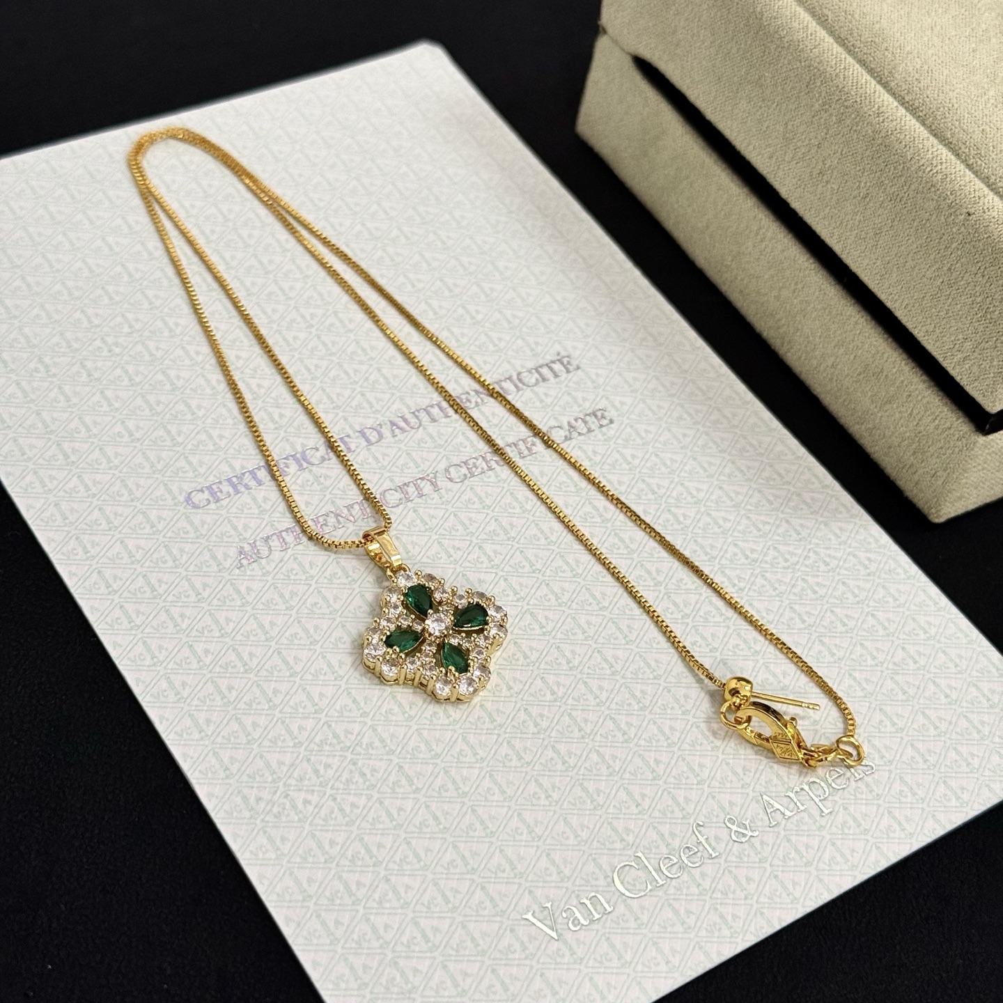 Van Cleef Arpels Alhambra necklace yellow gold metal with green gemstones and clear diamond accents 42cm