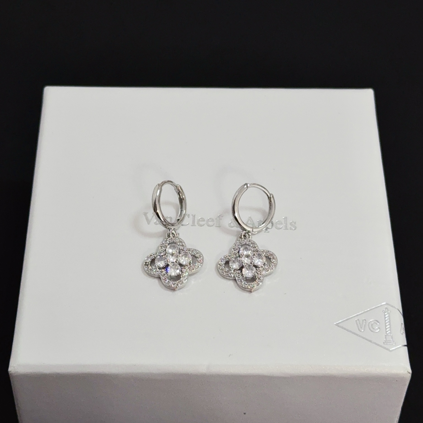Van Cleef Arpels Alhambra earrings silver-toned white gold metal clear diamond-like gemstones 12mm hoop diameter 10mm charm
