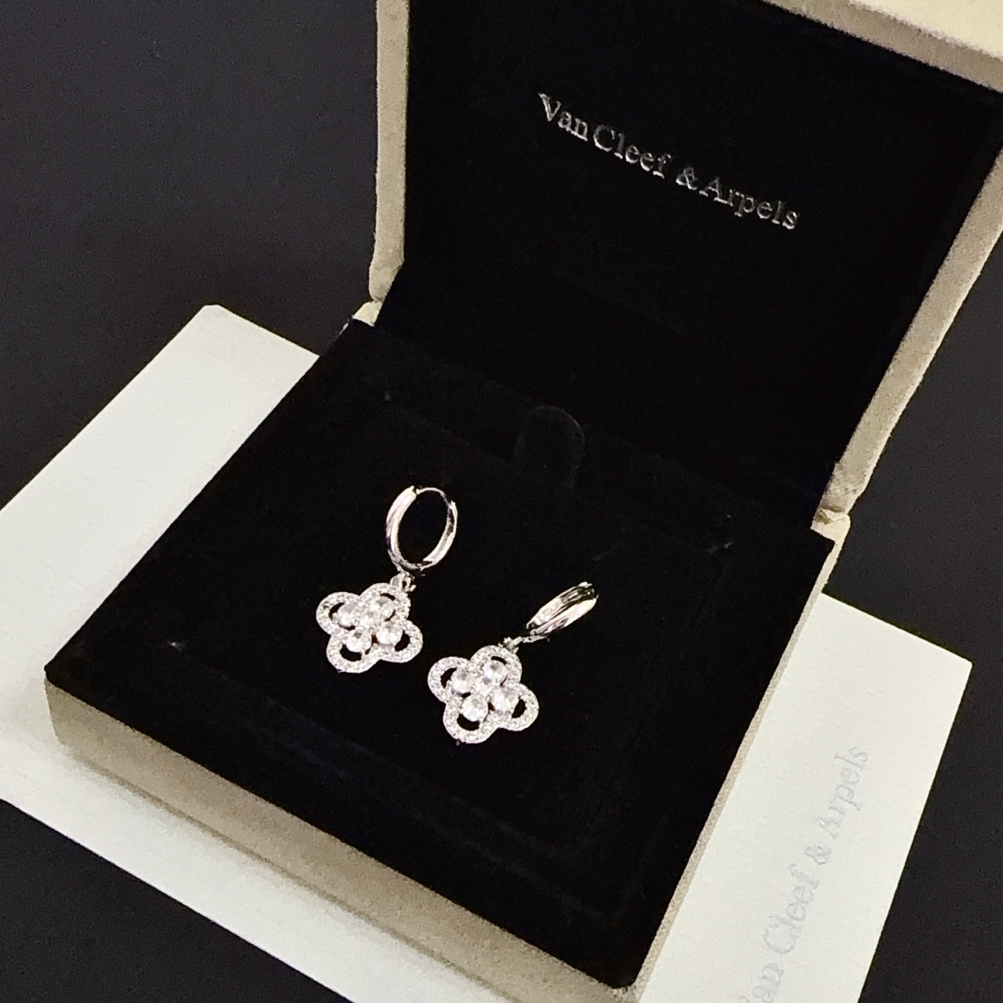 Van Cleef Arpels Alhambra earrings silver-toned white gold metal clear diamond-like gemstones 12mm hoop diameter 10mm charm