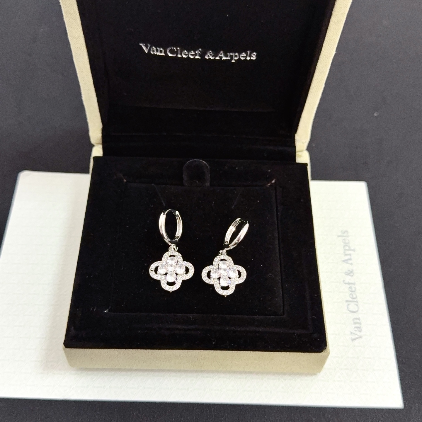 Van Cleef Arpels Alhambra earrings silver-toned white gold metal clear diamond-like gemstones 12mm hoop diameter 10mm charm