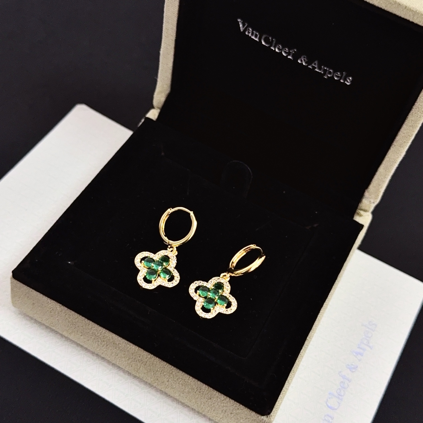 Van Cleef Arpels Alhambra earrings yellow gold metal with emerald green gemstones and clear diamond accents 12mm hoop diameter 10mm charm