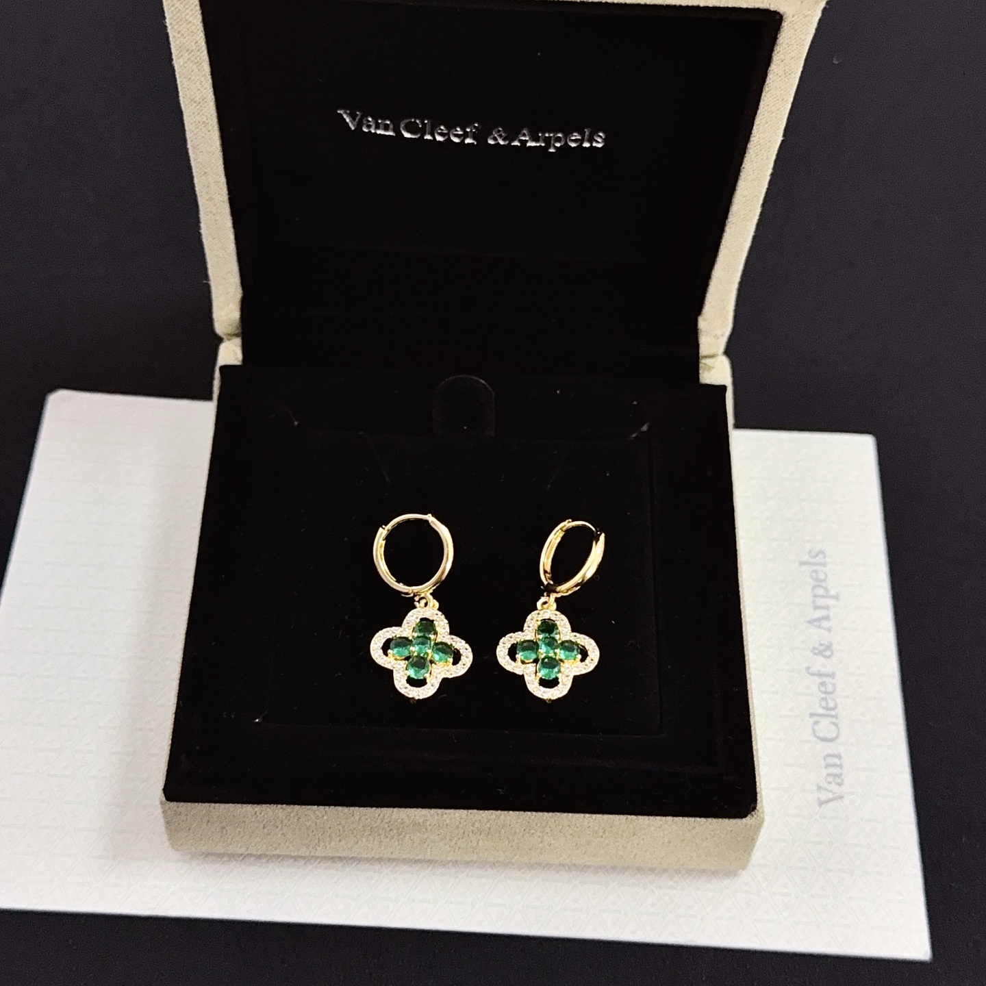 Van Cleef Arpels Alhambra earrings yellow gold metal with emerald green gemstones and clear diamond accents 12mm hoop diameter 10mm charm