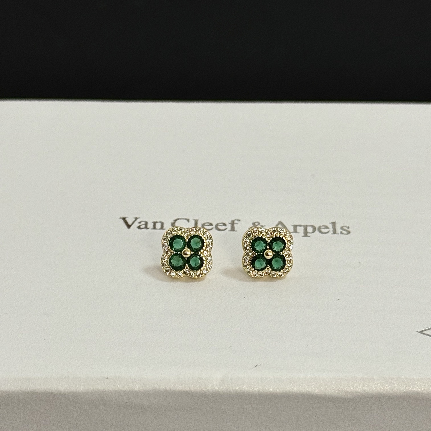 Van Cleef Arpels Alhambra earrings yellow gold metal with emerald green gemstones and white diamond accents 9mm stud diameter