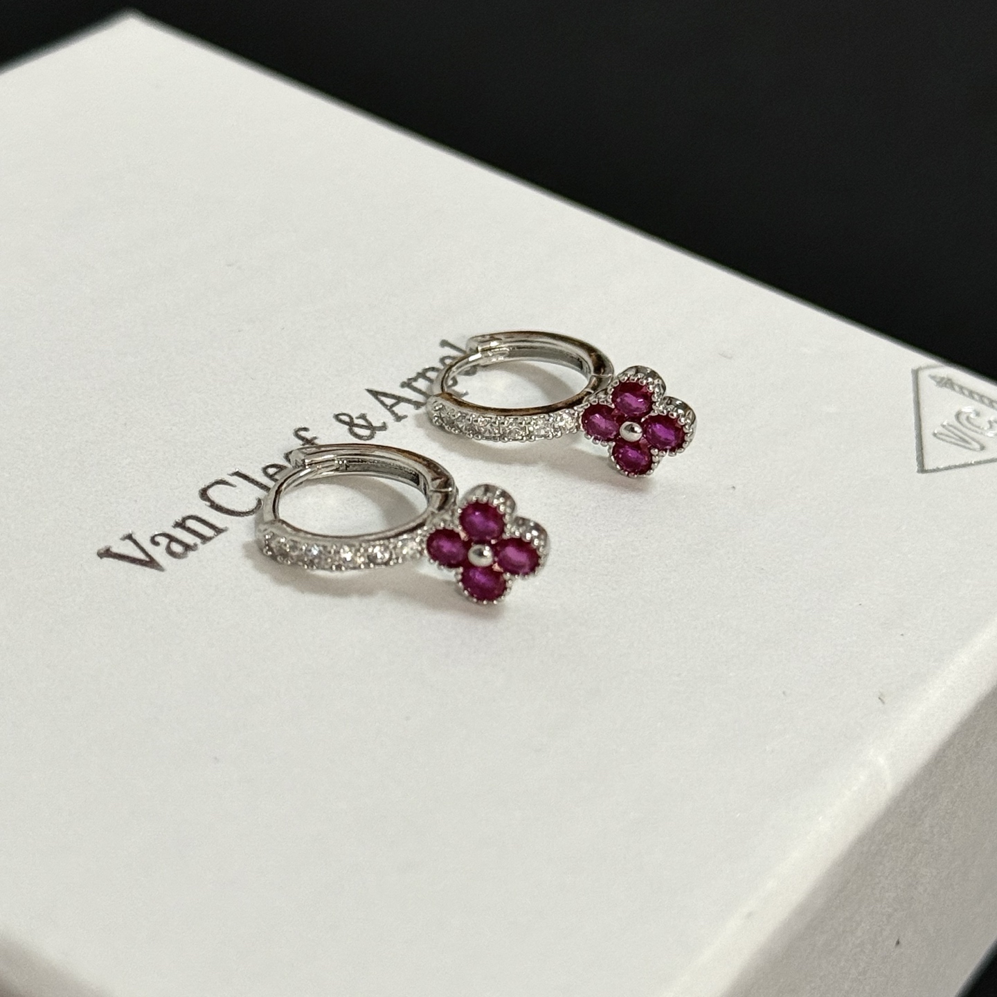 Van Cleef Arpels Alhambra earrings silver-toned white gold with clear diamonds and ruby-red four-leaf clover stones 1 5cm hoop diameter