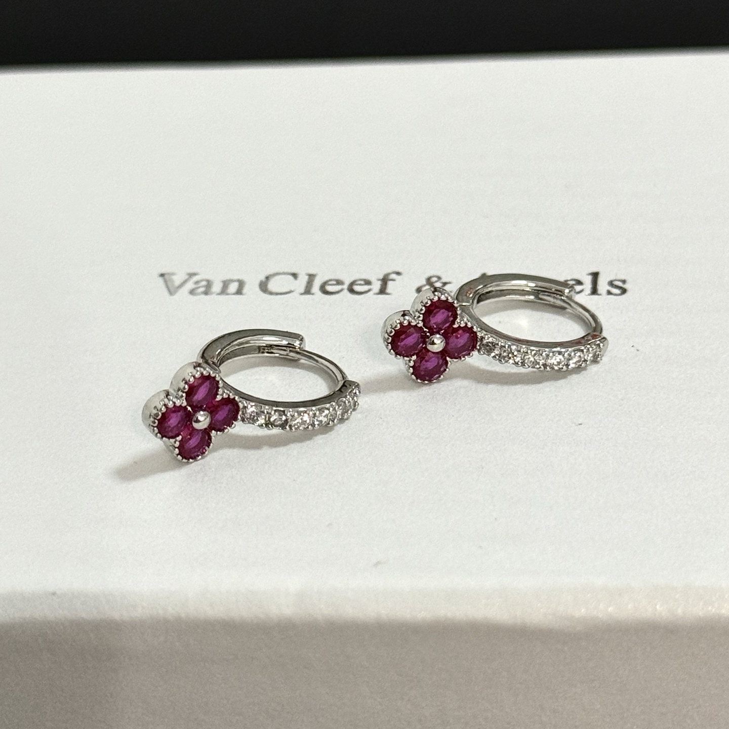 Van Cleef Arpels Alhambra earrings silver-toned white gold with clear diamonds and ruby-red four-leaf clover stones 1 5cm hoop diameter