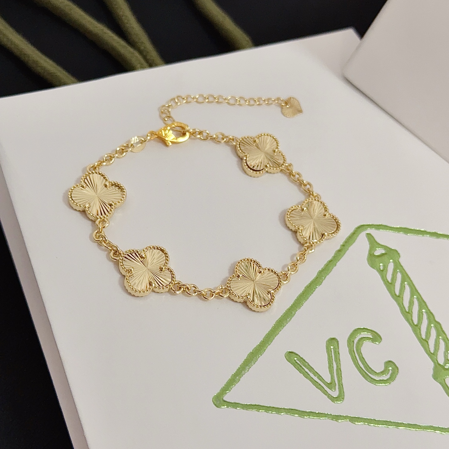 Van Cleef Arpels Alhambra bracelet gold tone metal with guilloche gold clover motifs 19cm