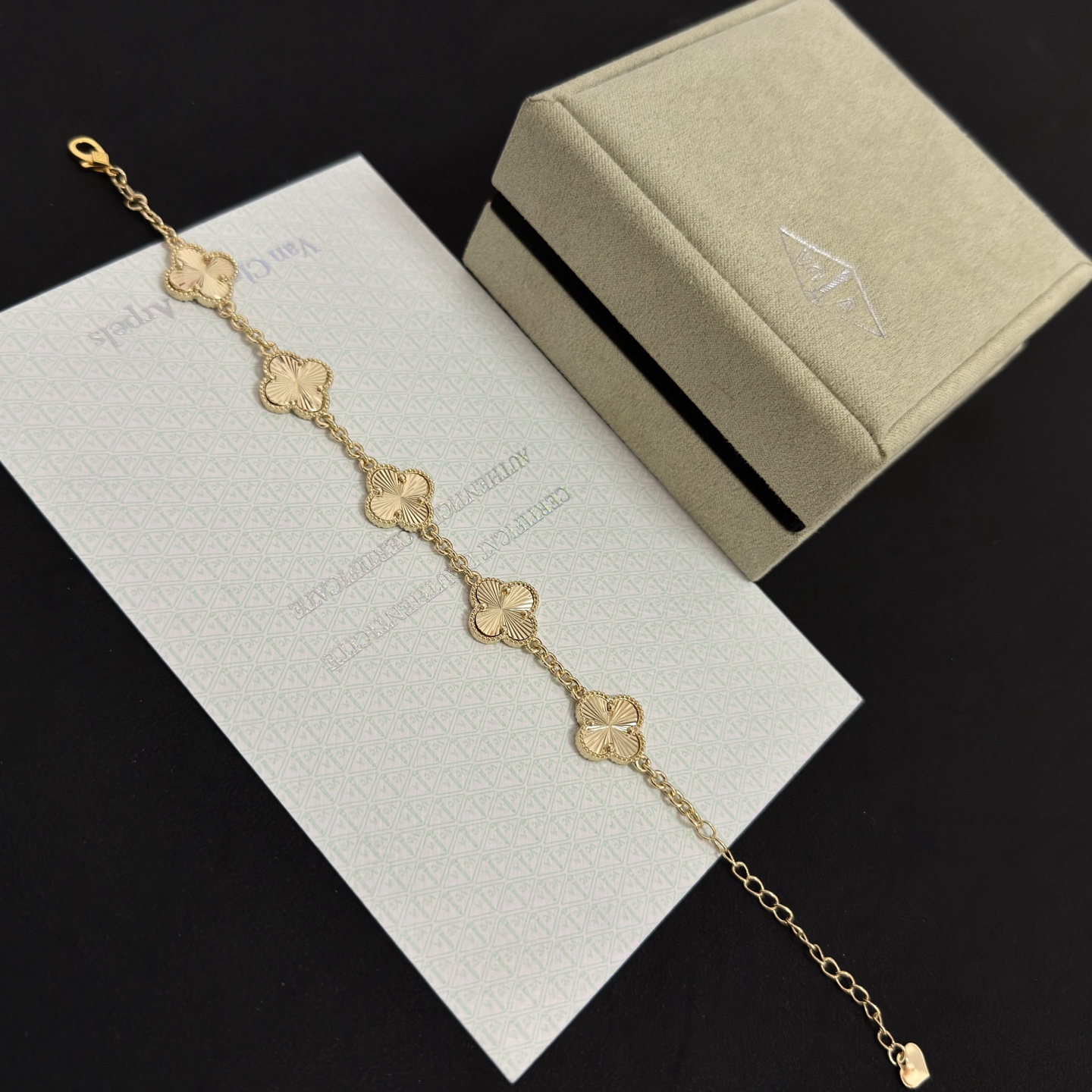 Van Cleef Arpels Alhambra bracelet gold tone metal with guilloche gold clover motifs 19cm