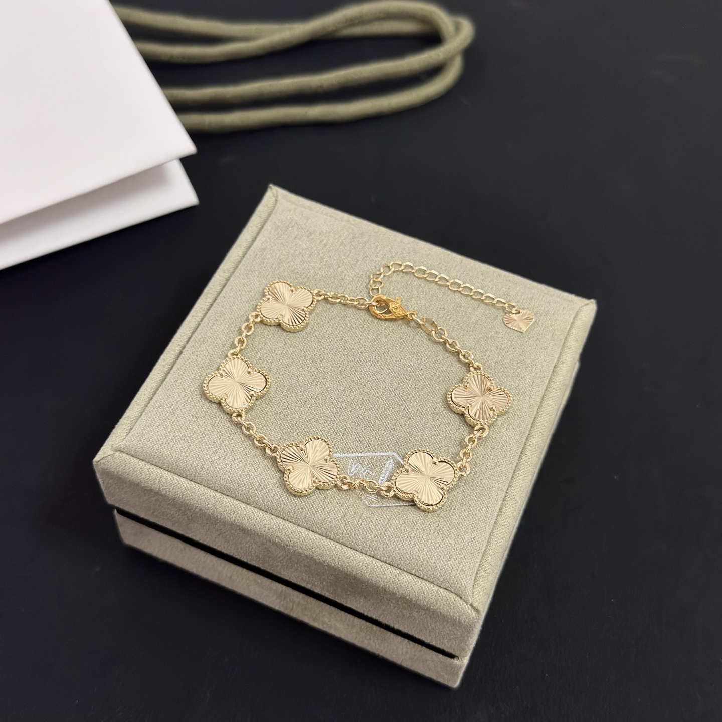 Van Cleef Arpels Alhambra bracelet gold tone metal with guilloche gold clover motifs 19cm