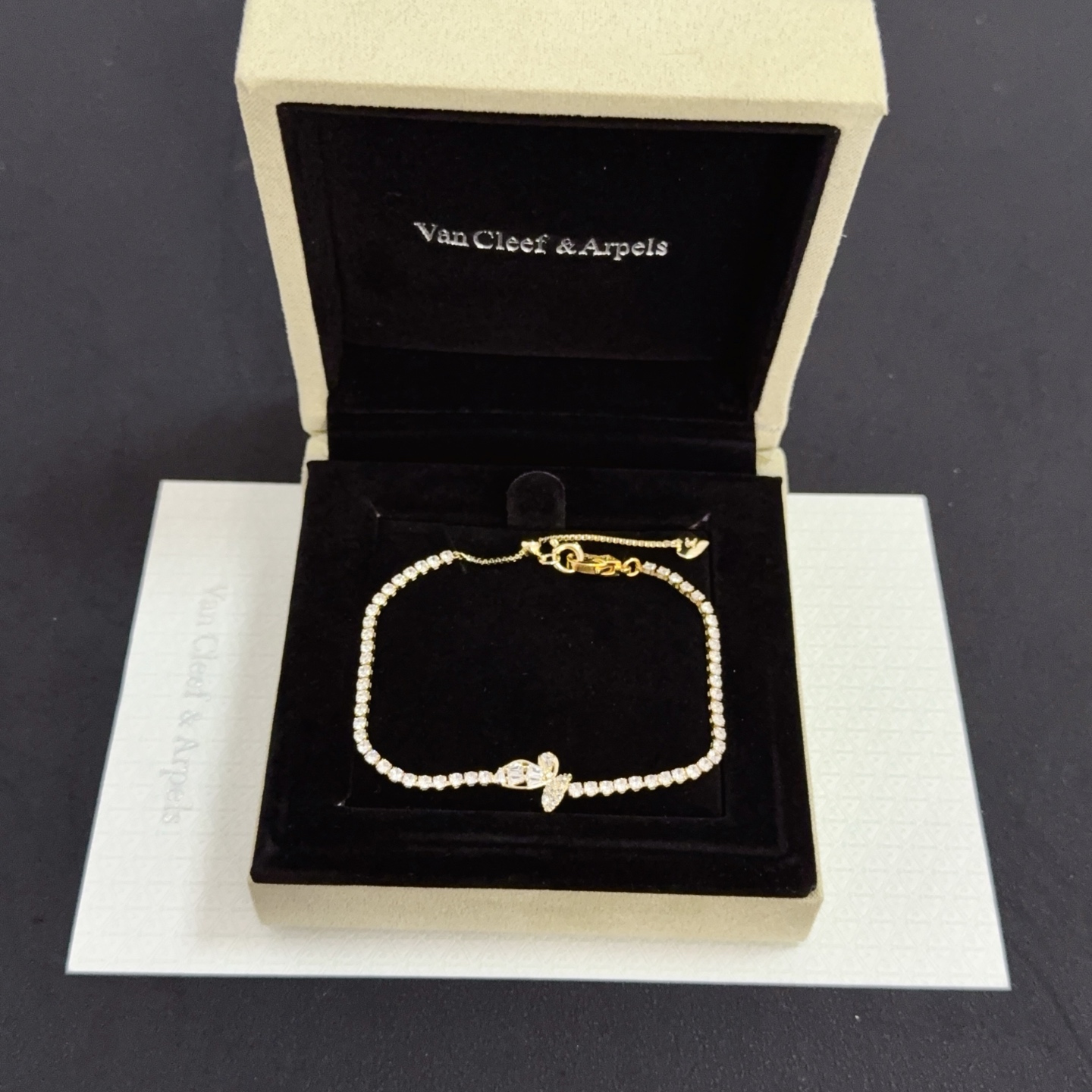Van Cleef Arpels Alhambra bracelet gold-tone metal with clear diamond-like stones 18cm