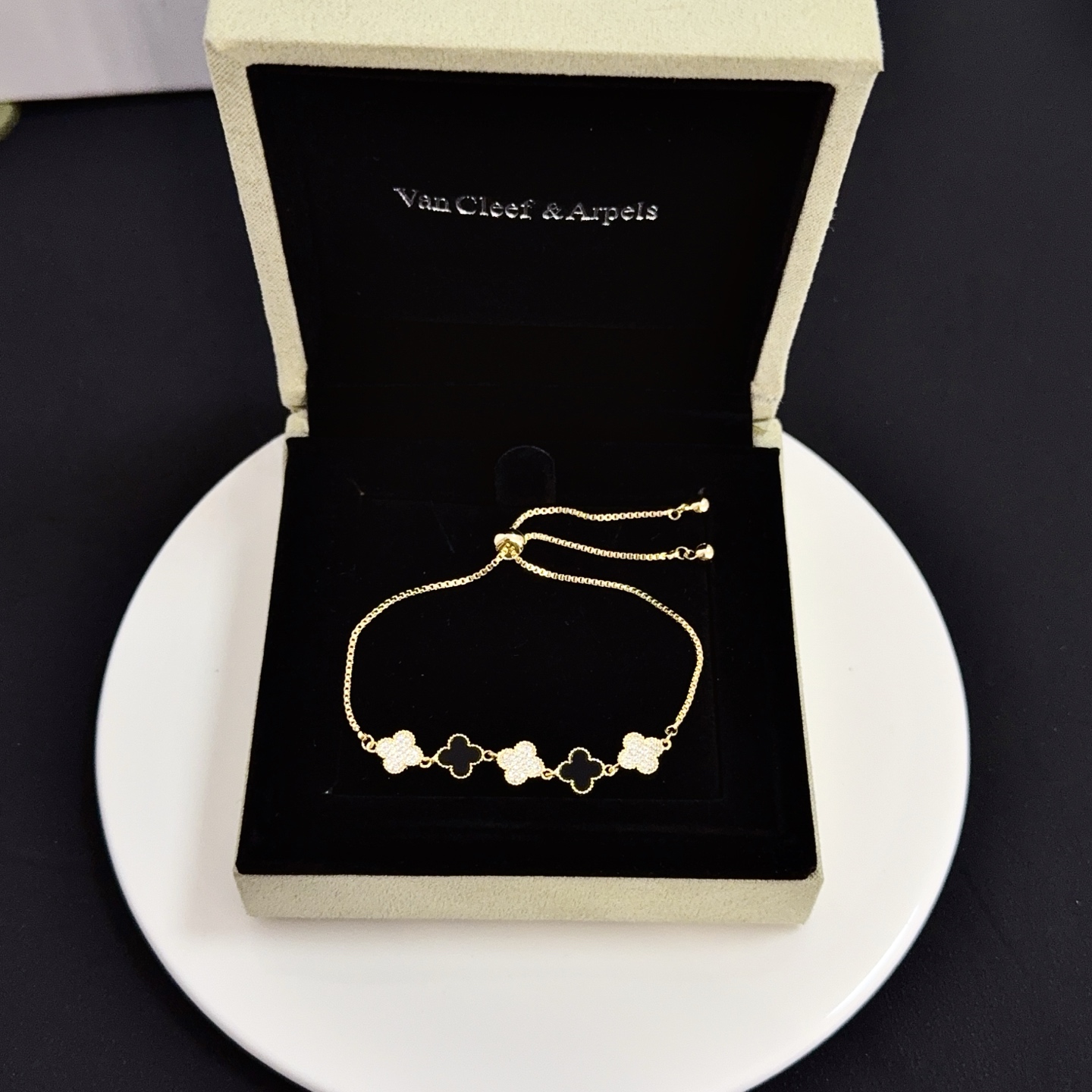 Van Cleef Arpels Alhambra bracelet yellow gold metal black onyx clover motifs clear diamond-paved clover motifs adjustable sliding bolo chain fits 15-20cm wrist