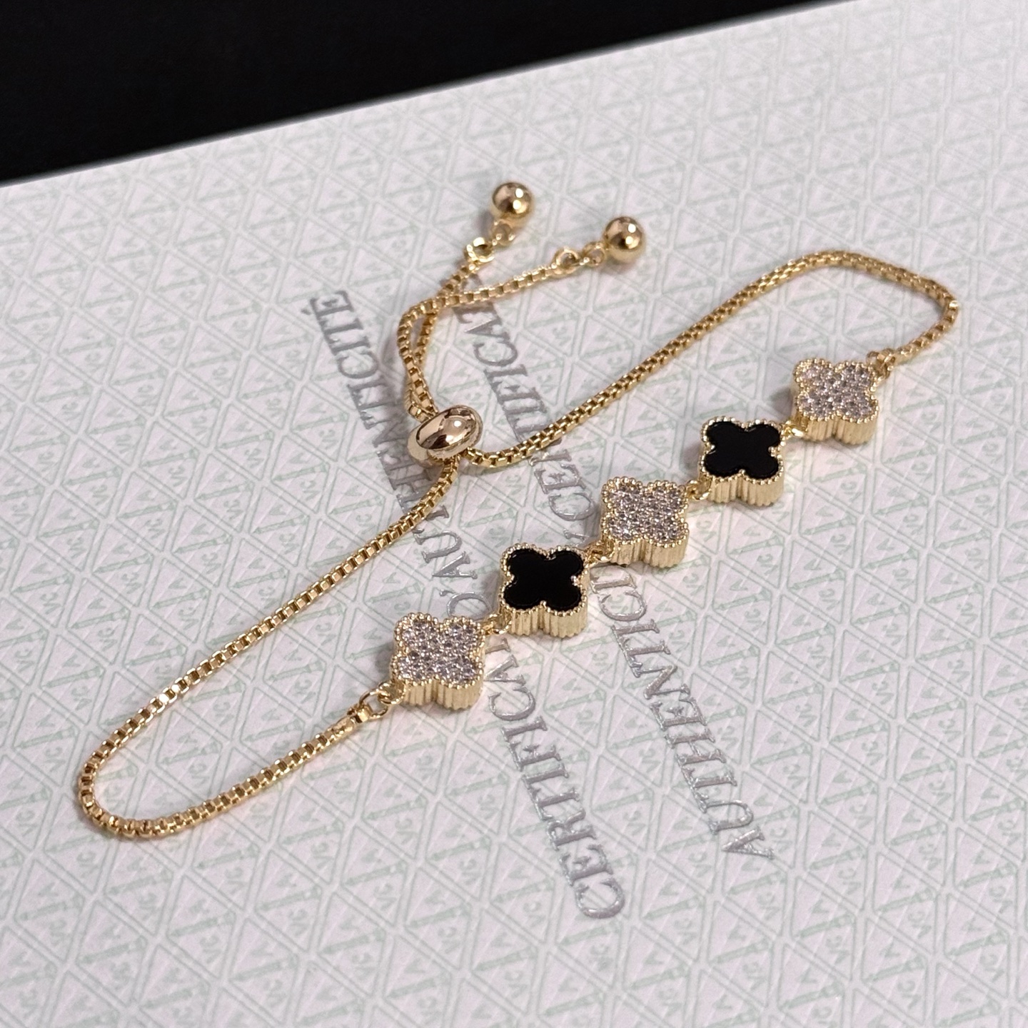 Van Cleef Arpels Alhambra bracelet yellow gold metal black onyx clover motifs clear diamond-paved clover motifs adjustable sliding bolo chain fits 15-20cm wrist