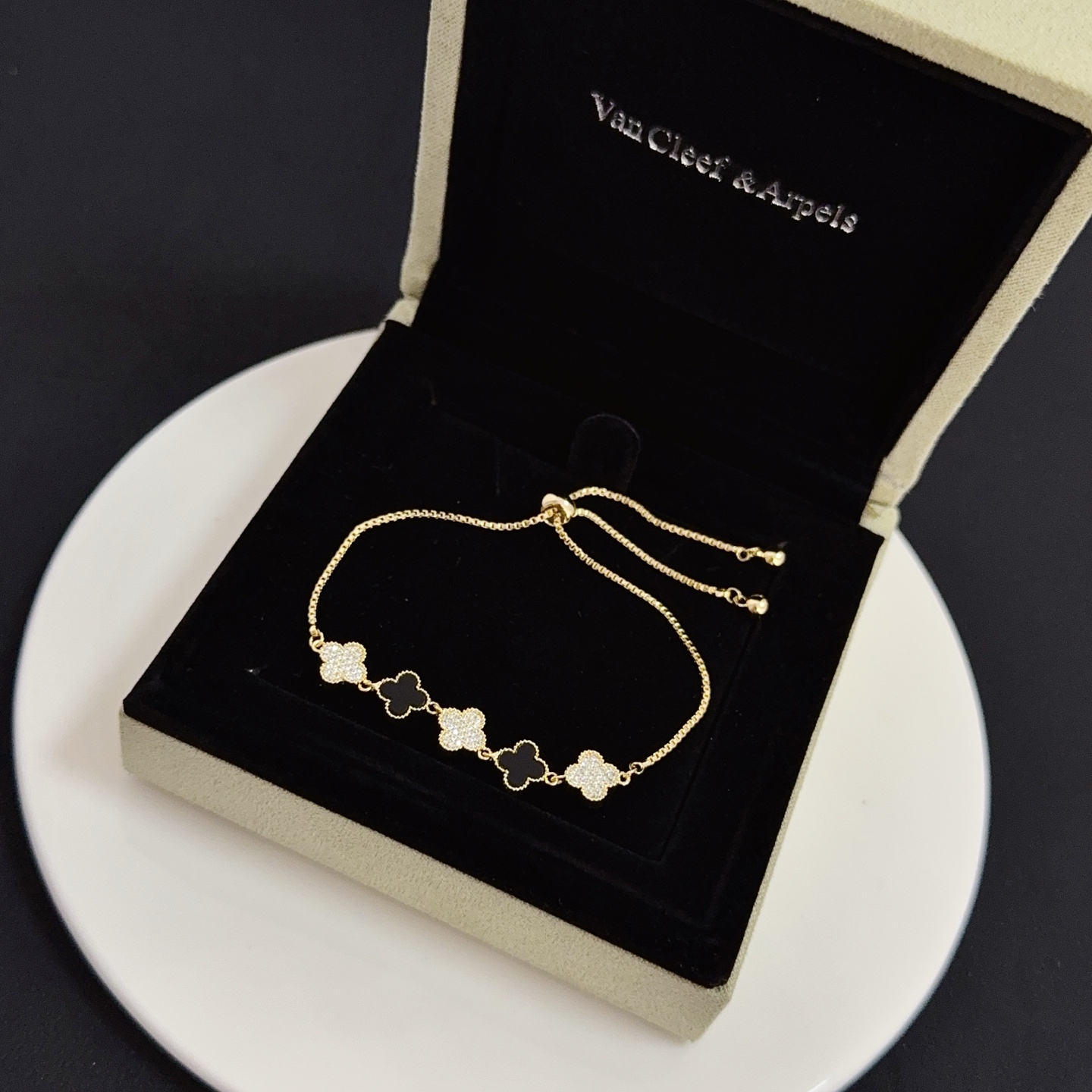 Van Cleef Arpels Alhambra bracelet yellow gold metal black onyx clover motifs clear diamond-paved clover motifs adjustable sliding bolo chain fits 15-20cm wrist