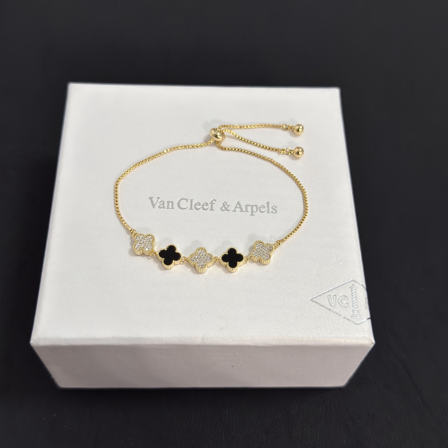 Van Cleef Arpels Alhambra bracelet yellow gold metal black onyx clover motifs clear diamond-paved clover motifs adjustable sliding bolo chain fits 15-20cm wrist