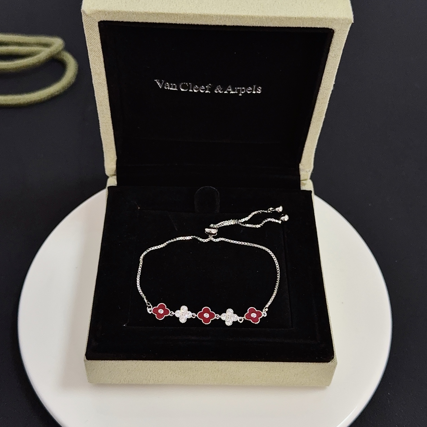 Van Cleef Arpels Alhambra bracelet silver-toned metal deep red carnelian-style enamel clear diamond accents adjustable slider chain 16-20cm