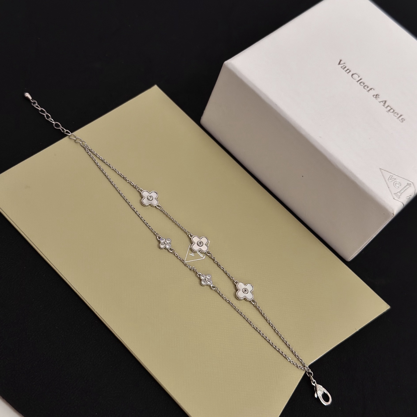 Van Cleef Arpels Alhambra bracelet silver-toned metal white mother-of-pearl clear diamond accents 17cm with 3cm extender