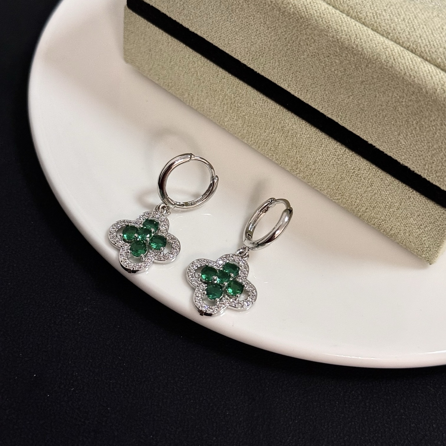 Van Cleef Arpels Alhambra earrings white gold with emerald green gemstones and clear diamond accents 12mm hoop diameter 10mm charm