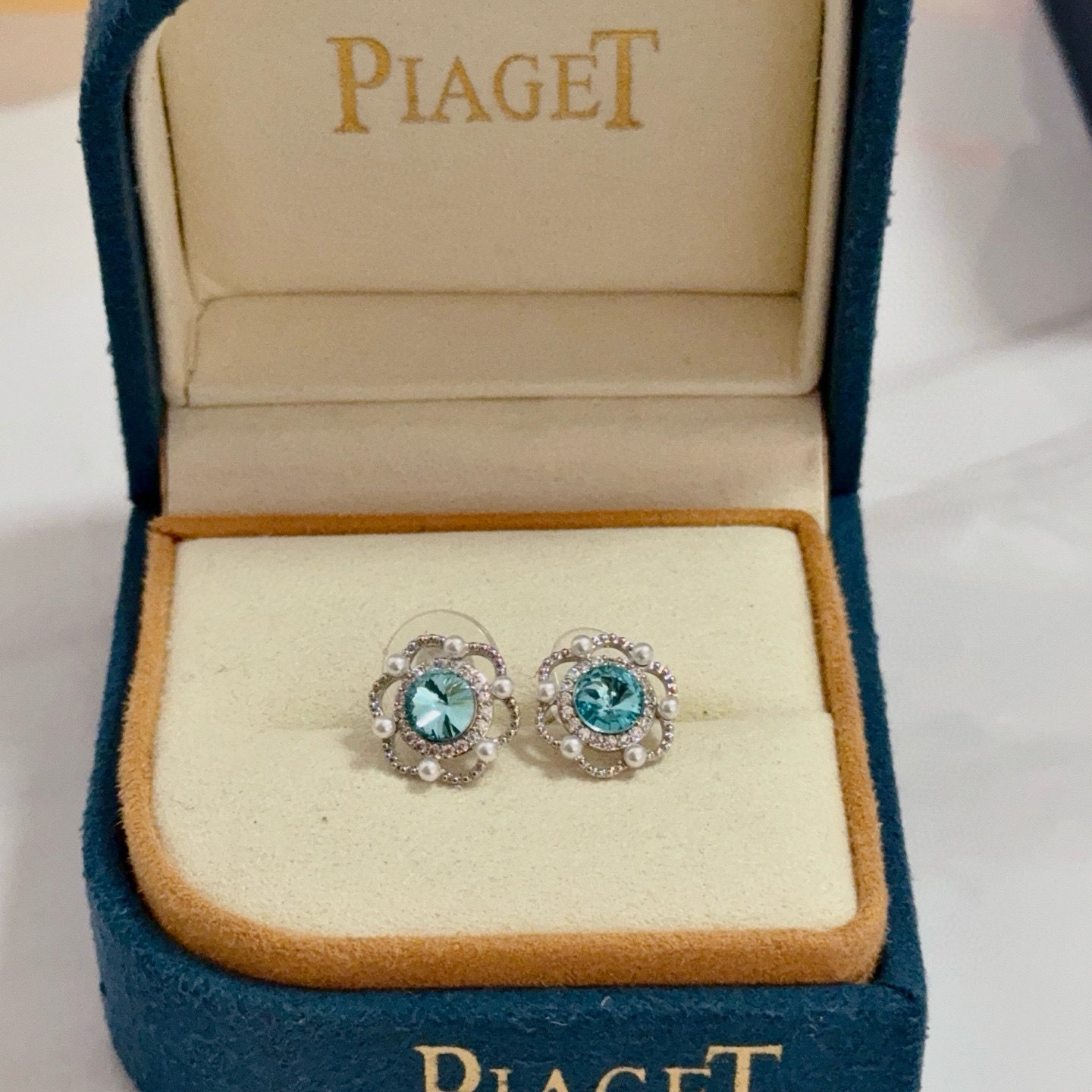 Piaget Rose earrings silver-toned metal paraiba tourmaline blue center stone white diamond accents white pearl accents 10mm stud diameter