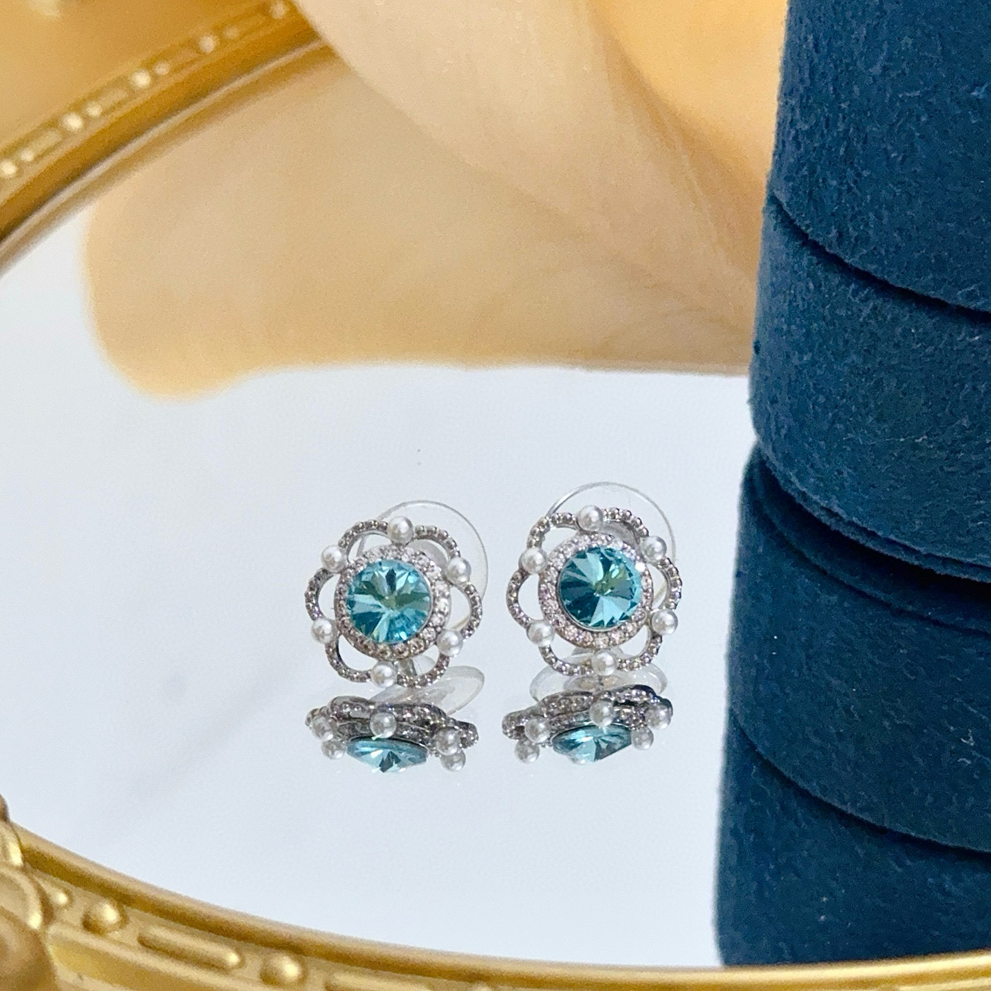 Piaget Rose earrings silver-toned metal paraiba tourmaline blue center stone white diamond accents white pearl accents 10mm stud diameter