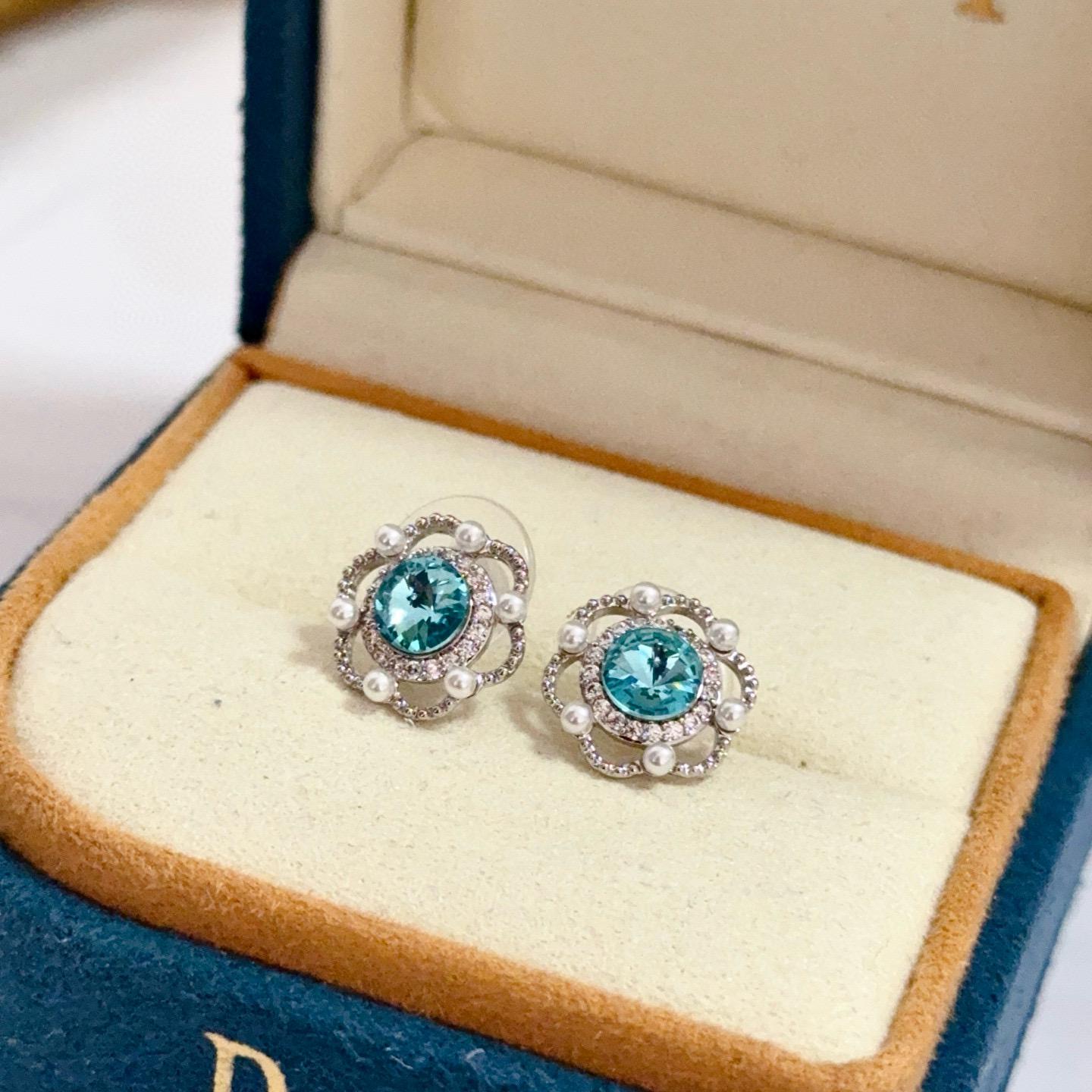 Piaget Rose earrings silver-toned metal paraiba tourmaline blue center stone white diamond accents white pearl accents 10mm stud diameter