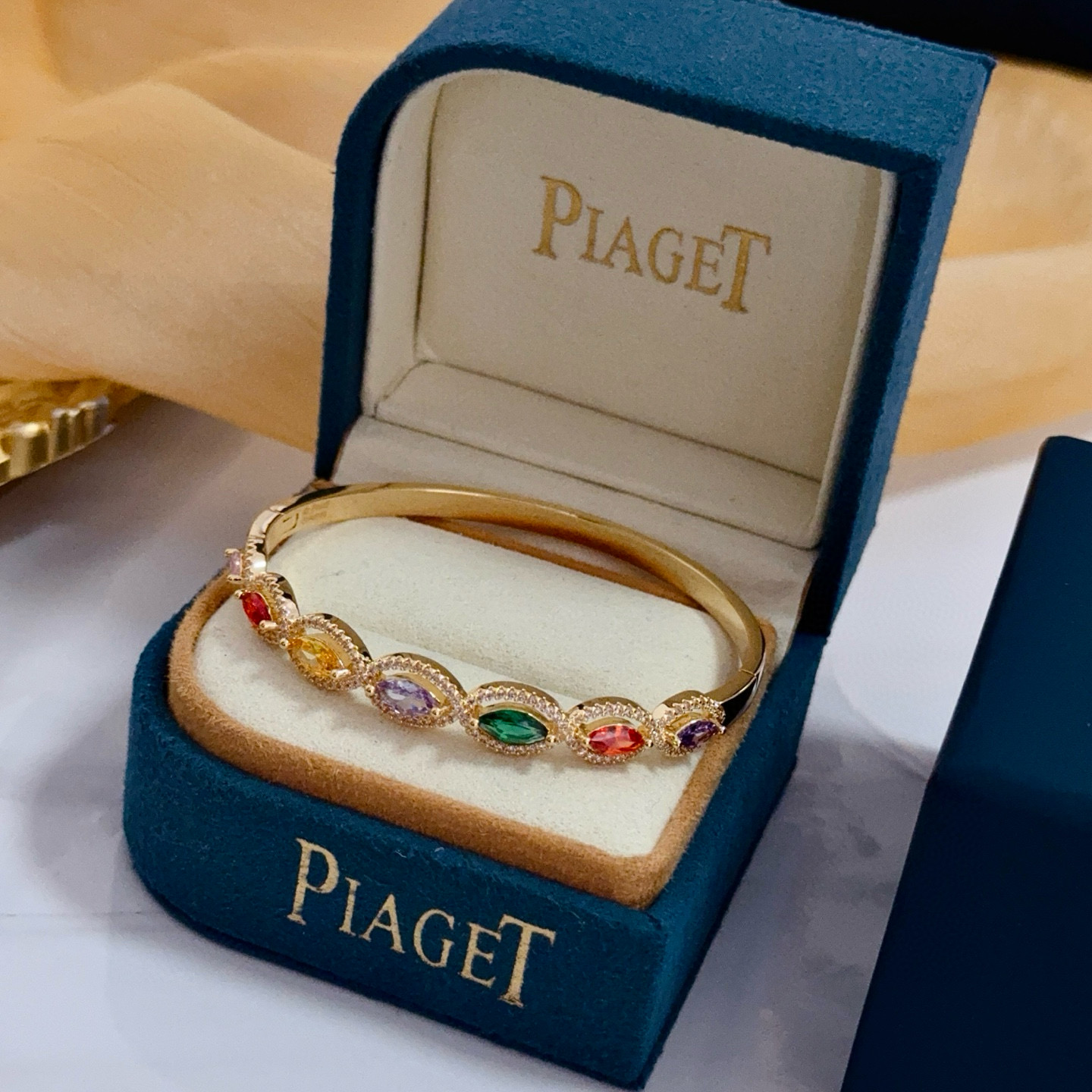 Piaget Rose des Vents Multicolor Gemstone Bangle bracelet Yellow gold metal with pink red orange yellow purple green marquise-cut gemstones accented by clear pave stones 17cm inner circumference