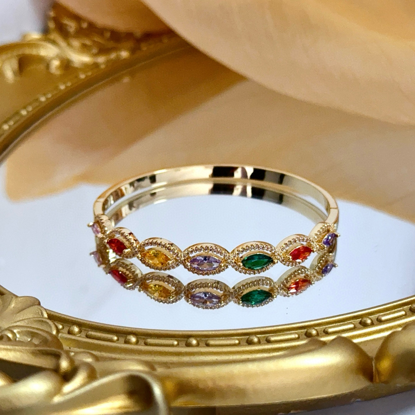 Piaget Rose des Vents Multicolor Gemstone Bangle bracelet Yellow gold metal with pink red orange yellow purple green marquise-cut gemstones accented by clear pave stones 17cm inner circumference