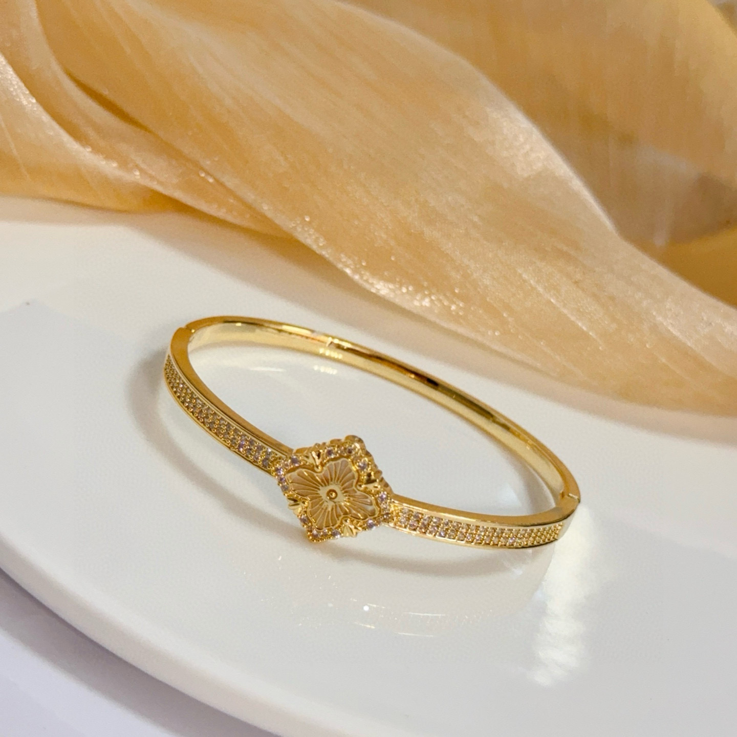 Piaget Rose bracelet yellow gold with clear diamond accents and mother-of-pearl flower detail 17cm inner circumference